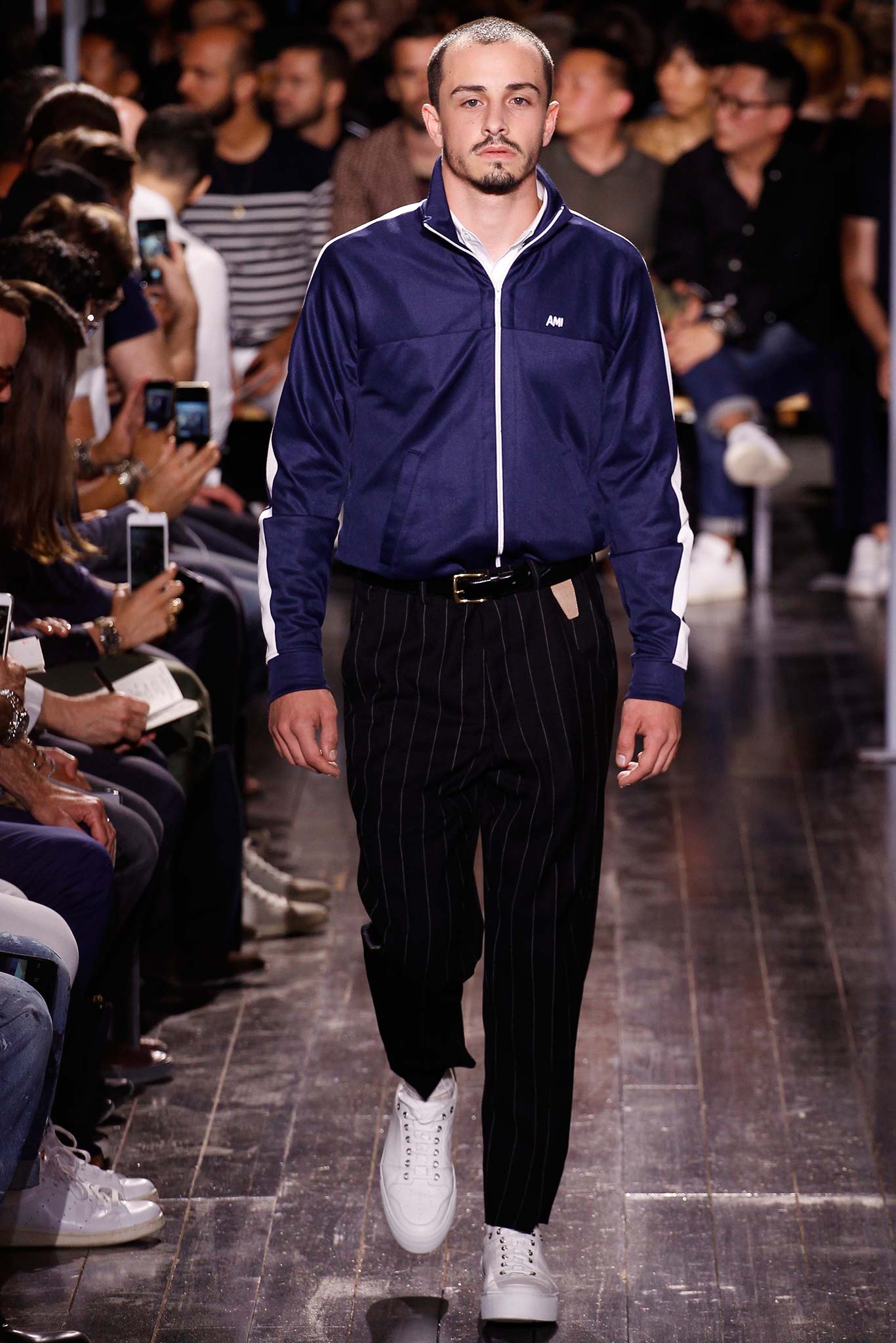 blue fitted jacket with black striped pants