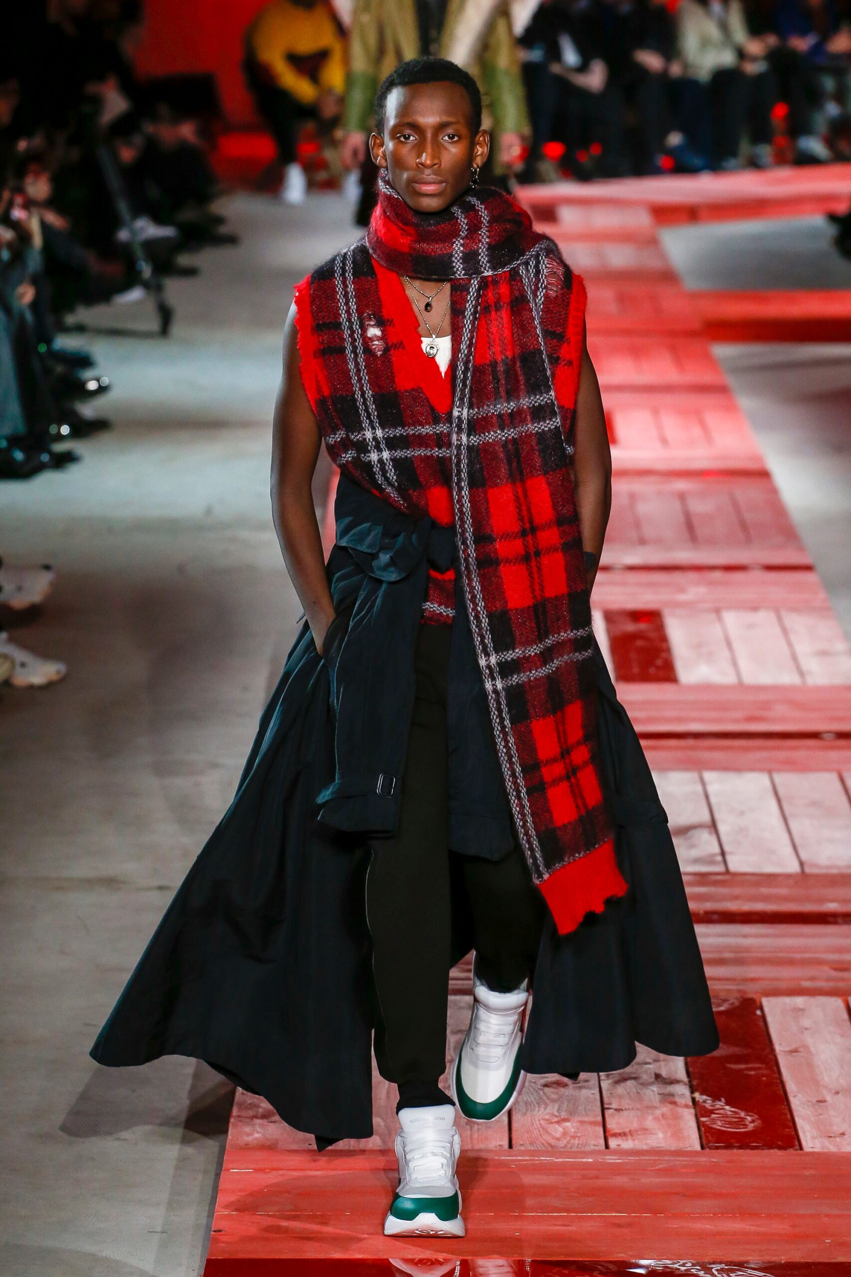 black coat with red sweater