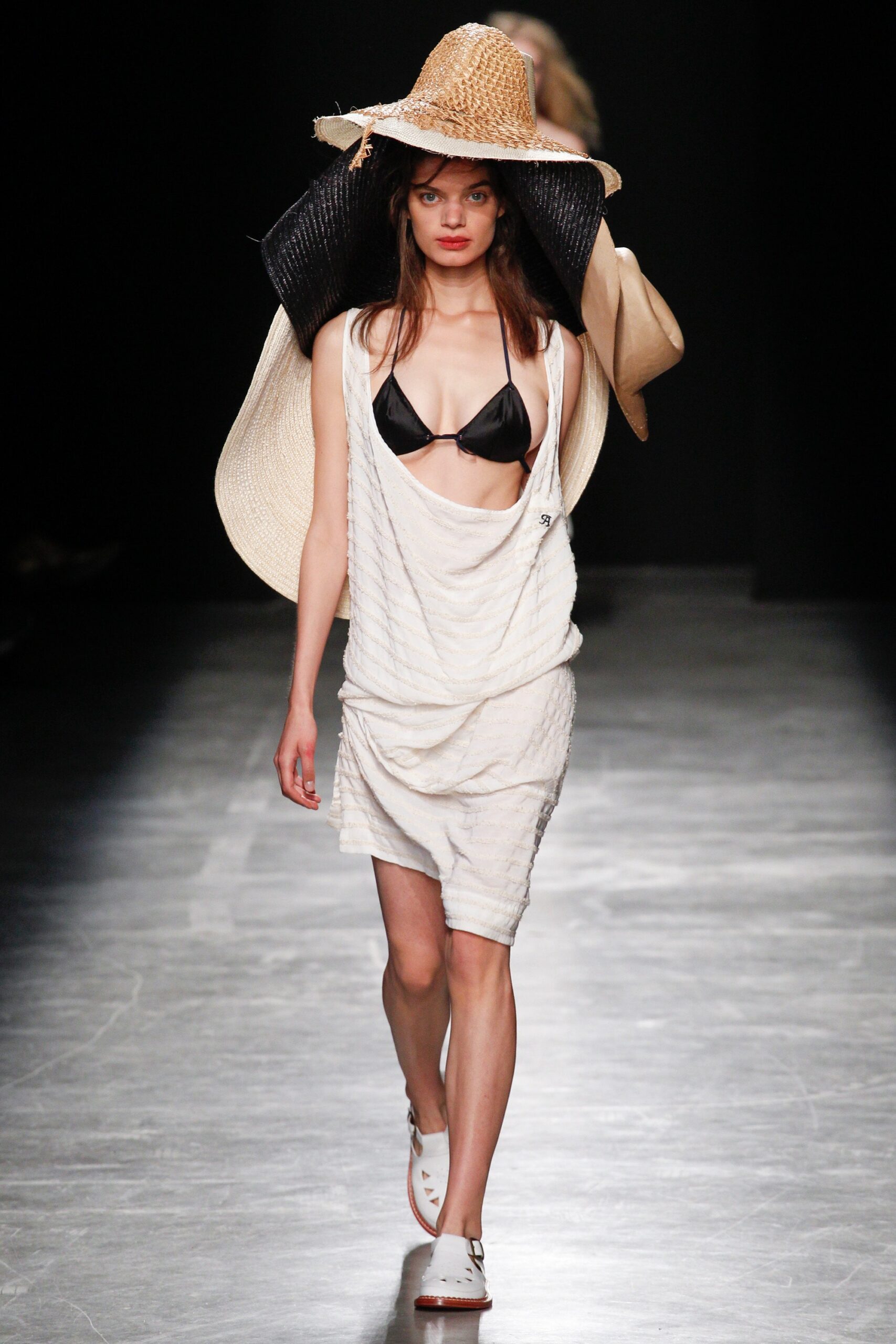 white relaxed dress with black bikini