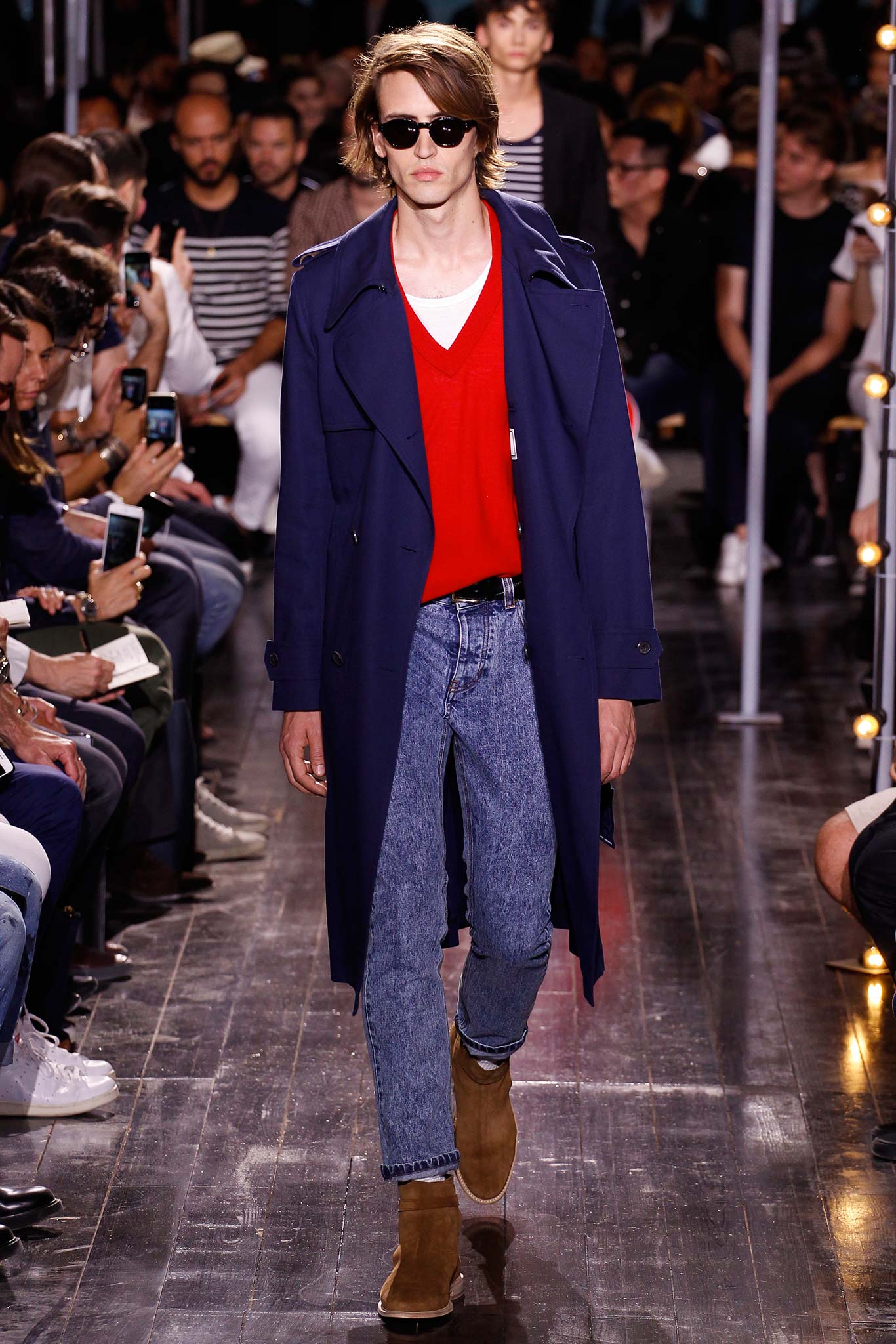 blue coat red sweater jeans