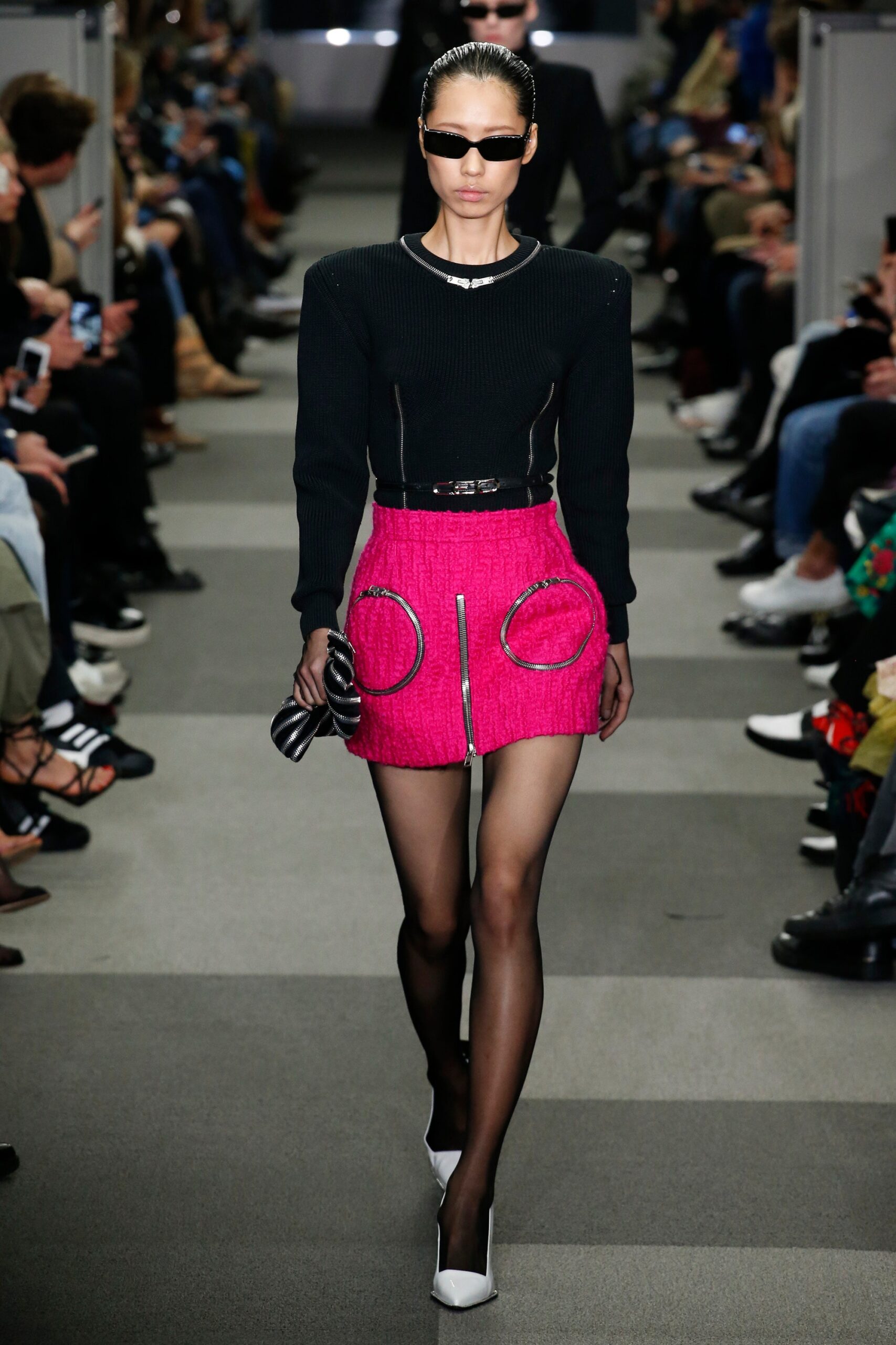 black fitted top and pink mini skirt