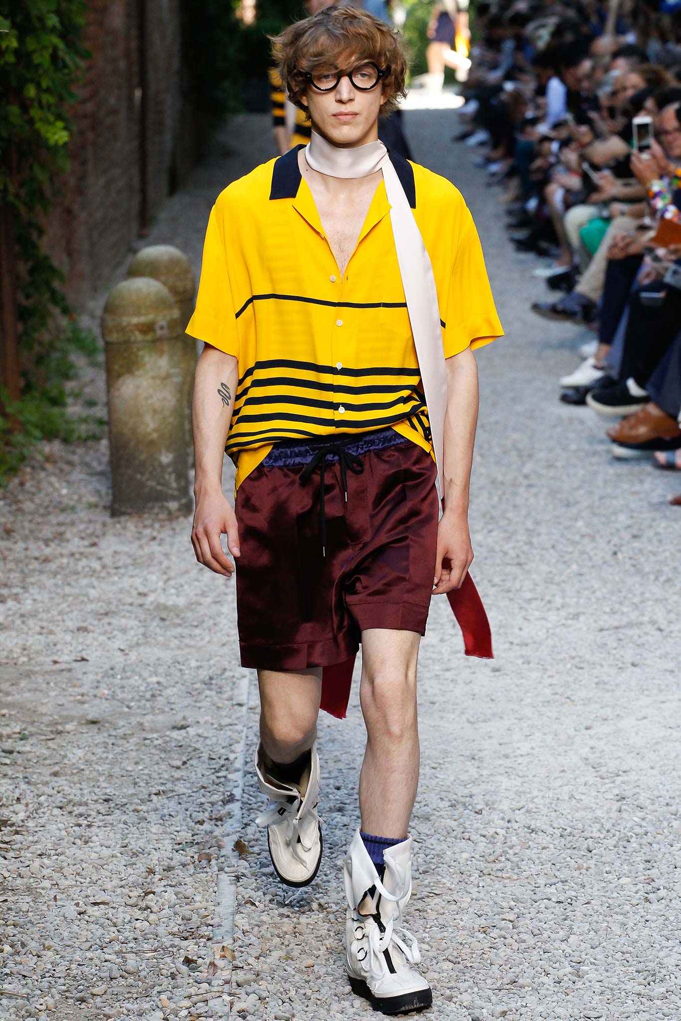 yellow striped shirt with maroon shorts