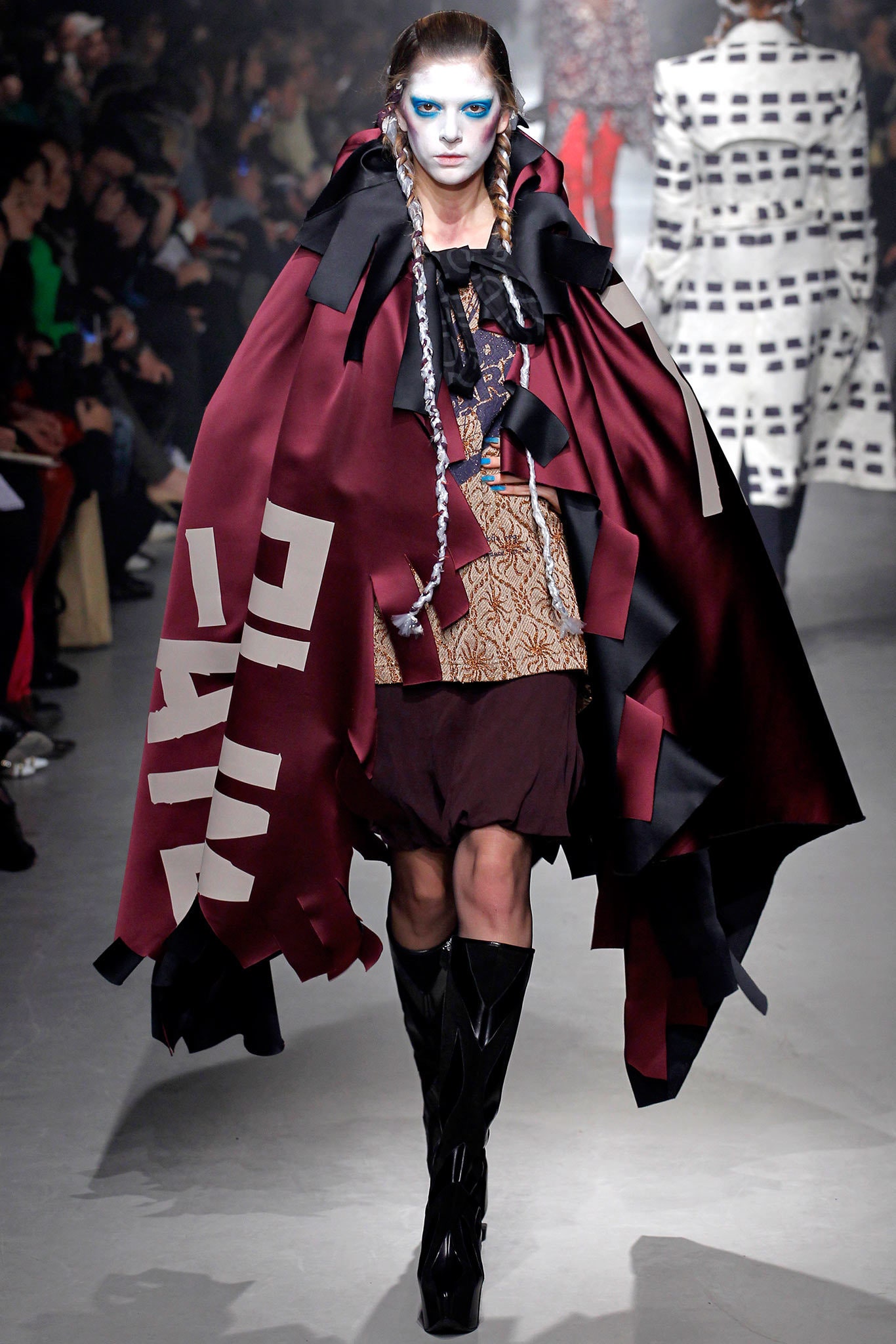 oversized red cape with fitted black dress