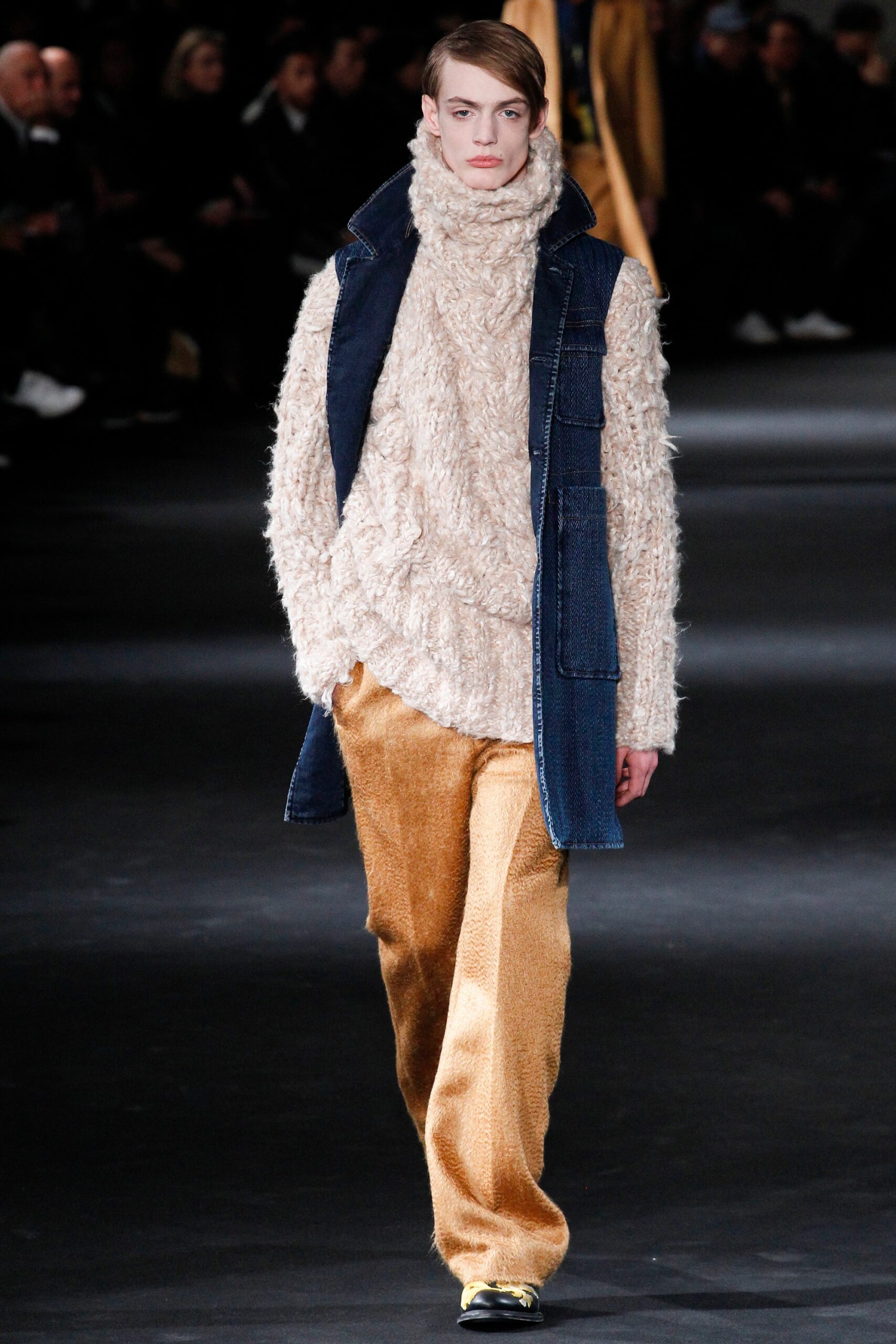 beige wool sweater with blue denim vest and gold velvet pants
