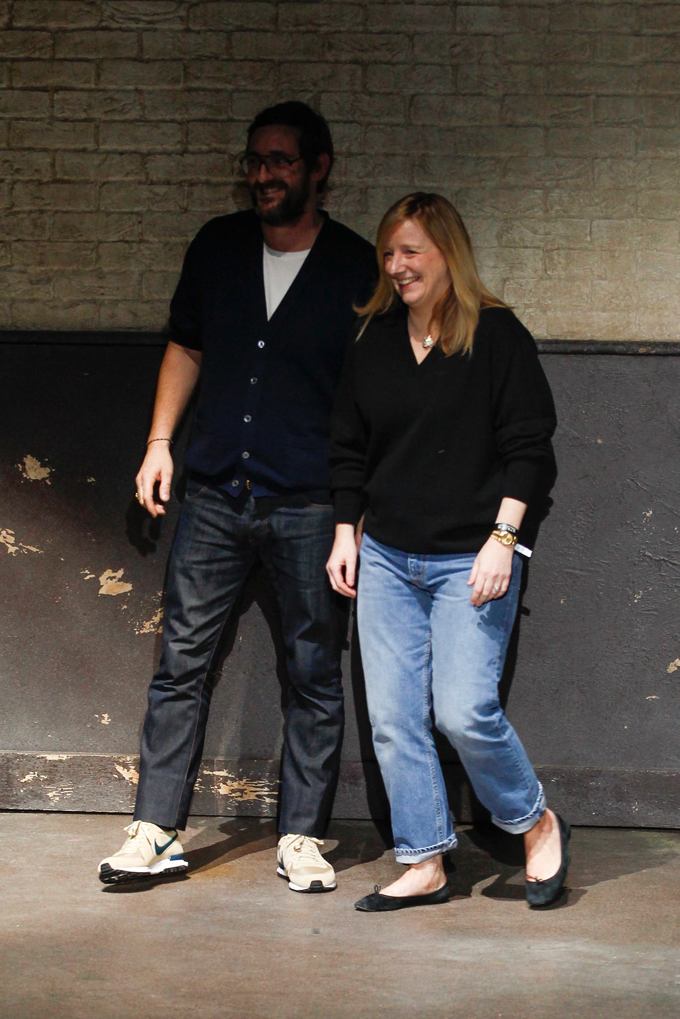 black sweater with blue jeans