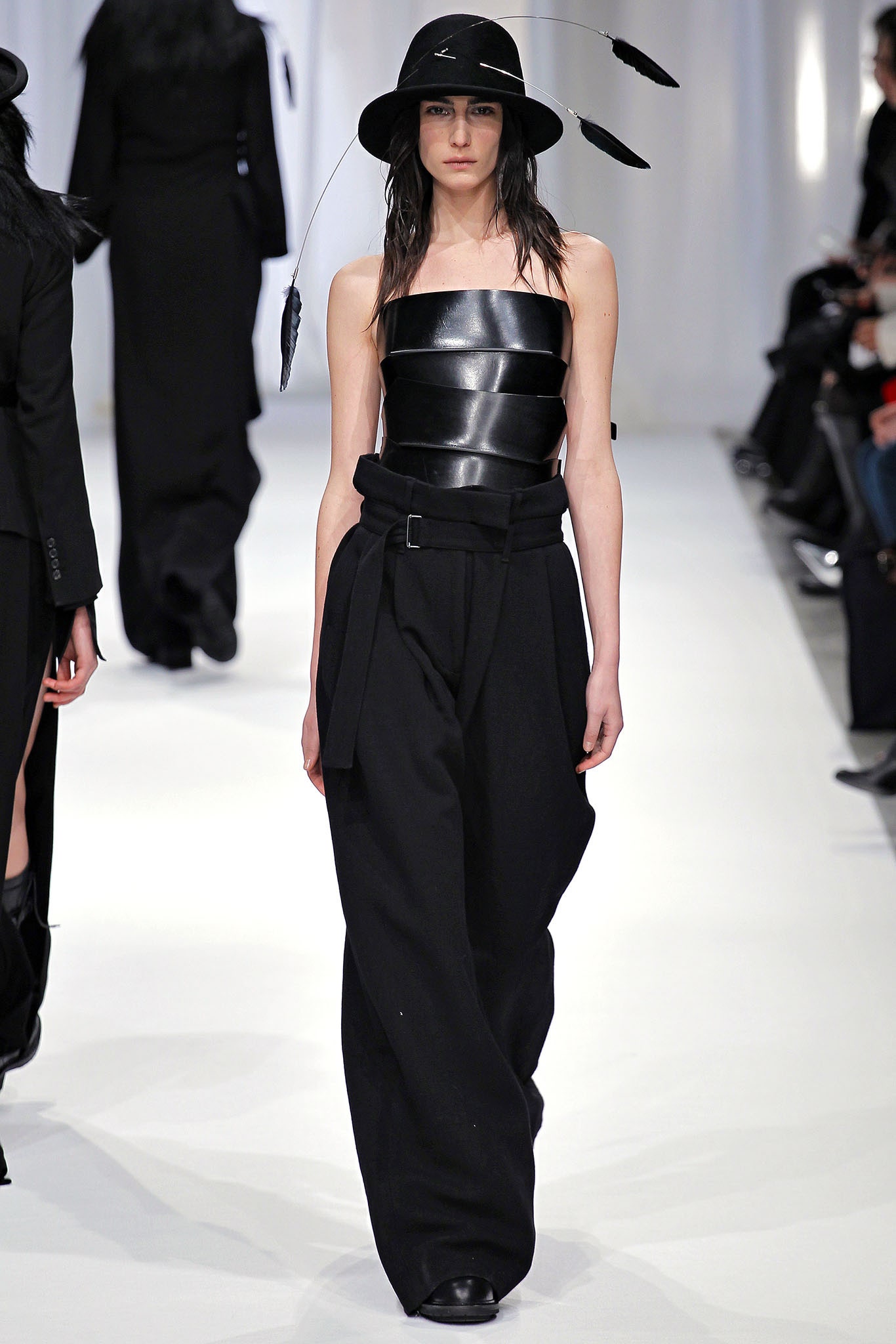 black leather strapless top with wide-leg pants