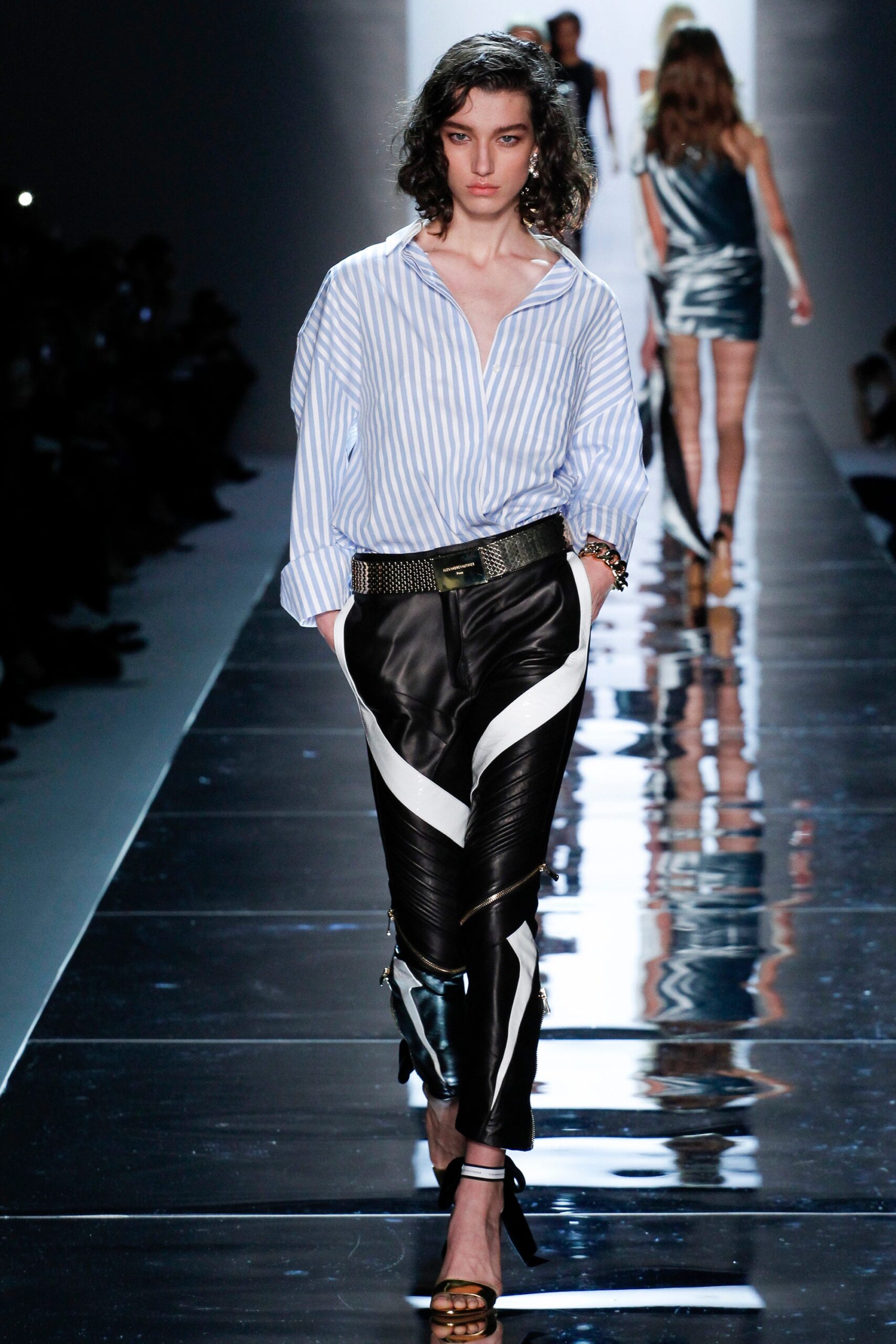 blue striped shirt and black leather pants