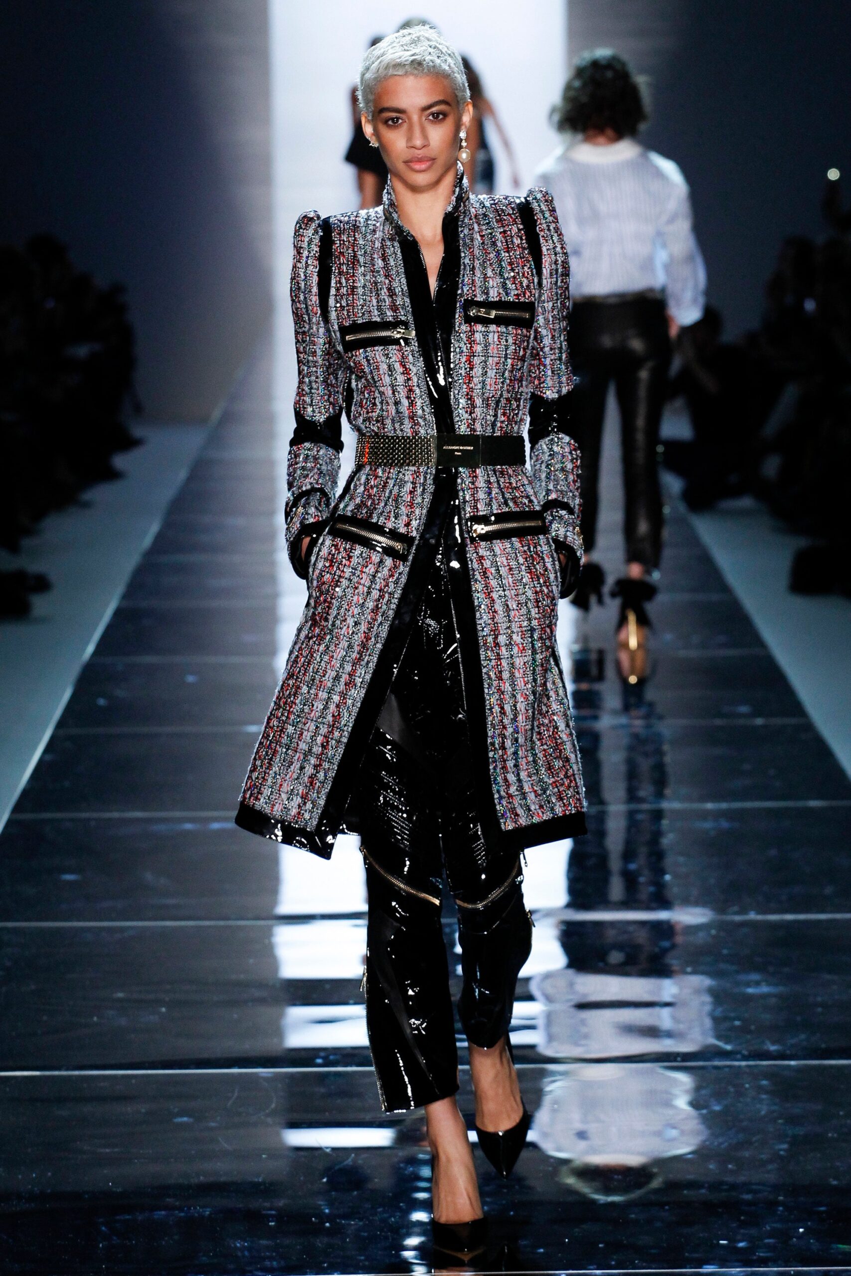 fitted multi-colored wool coat and shiny black pants