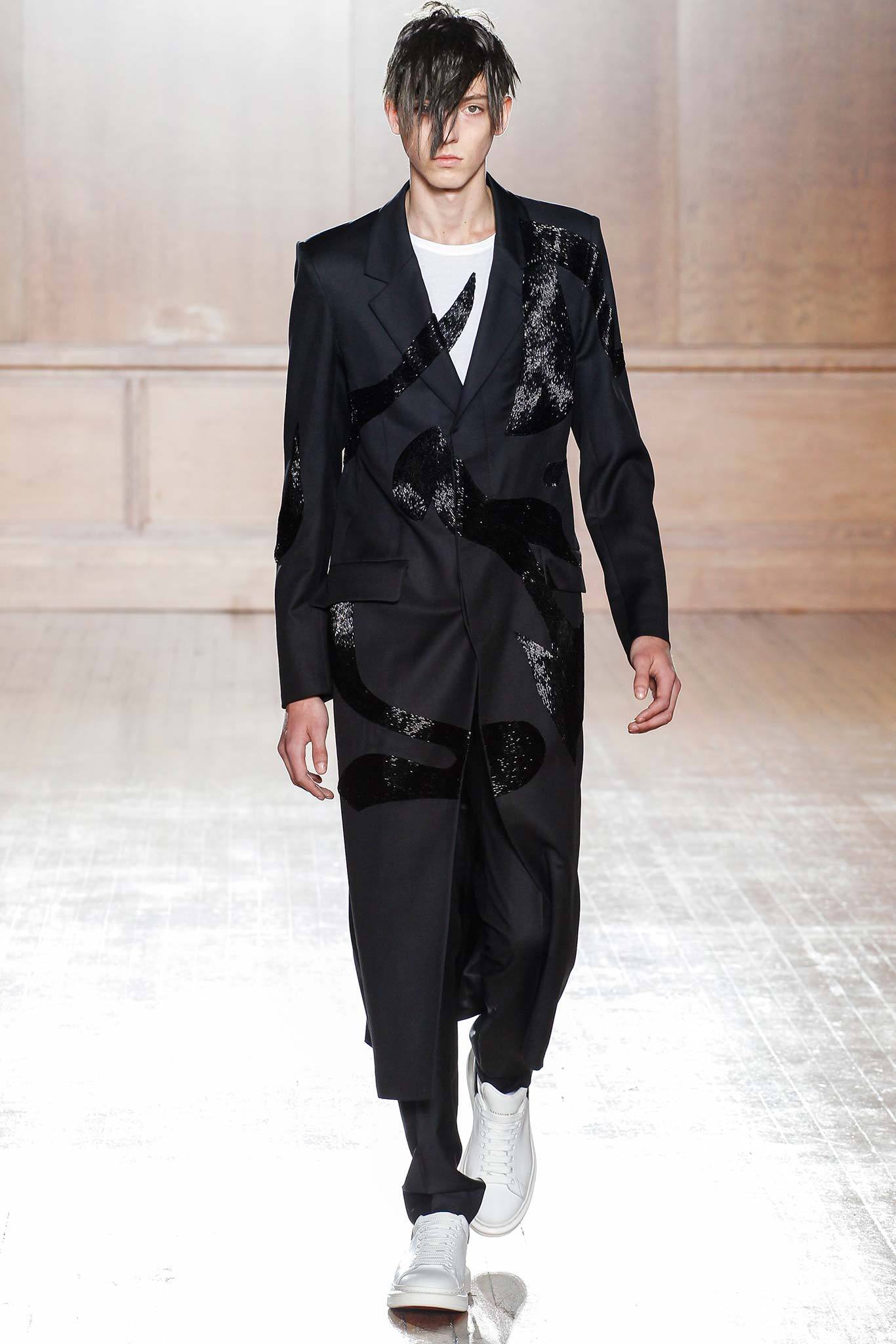 black tailored suit with white shoes