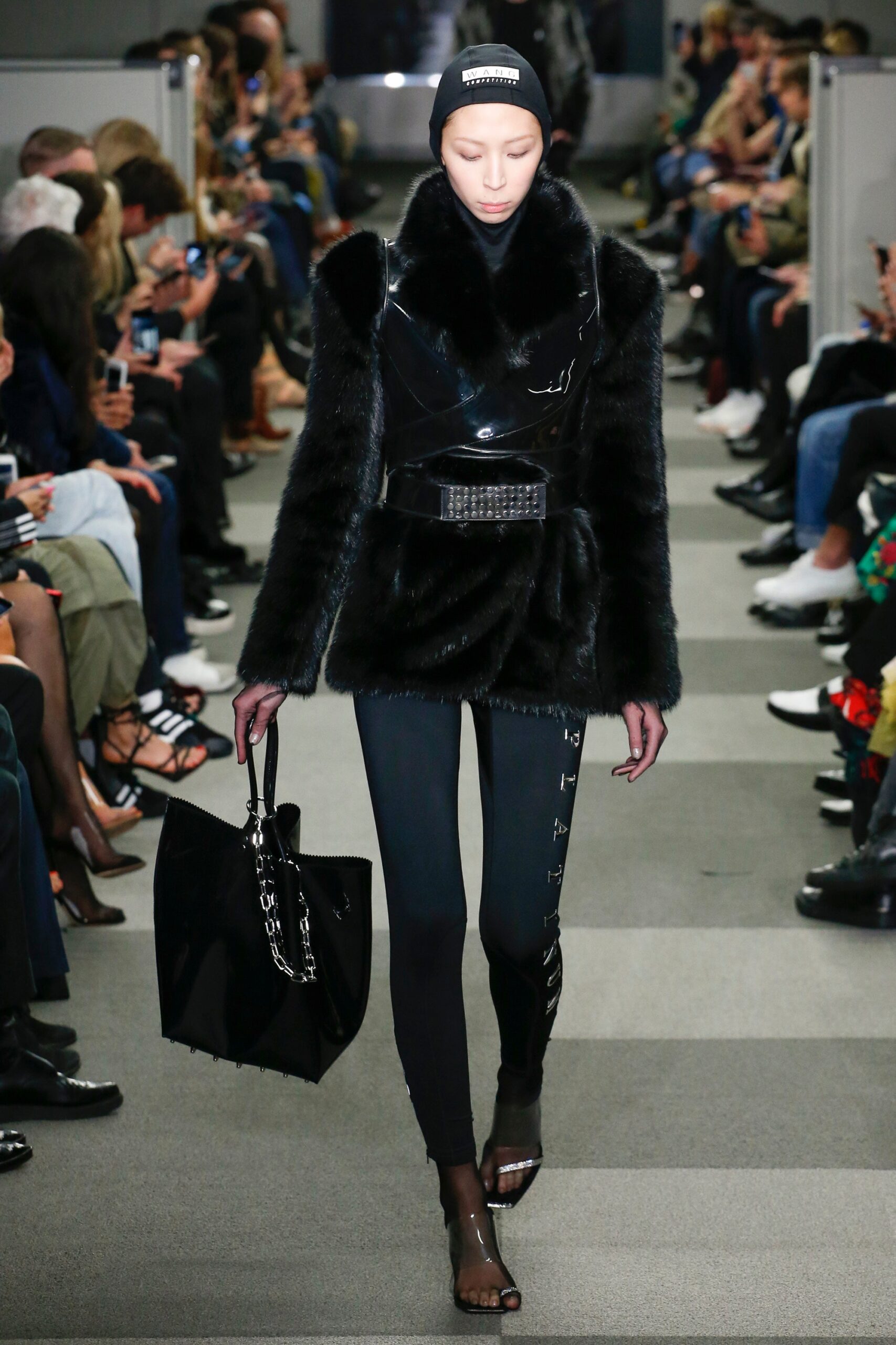 black faux-fur coat with vinyl pants