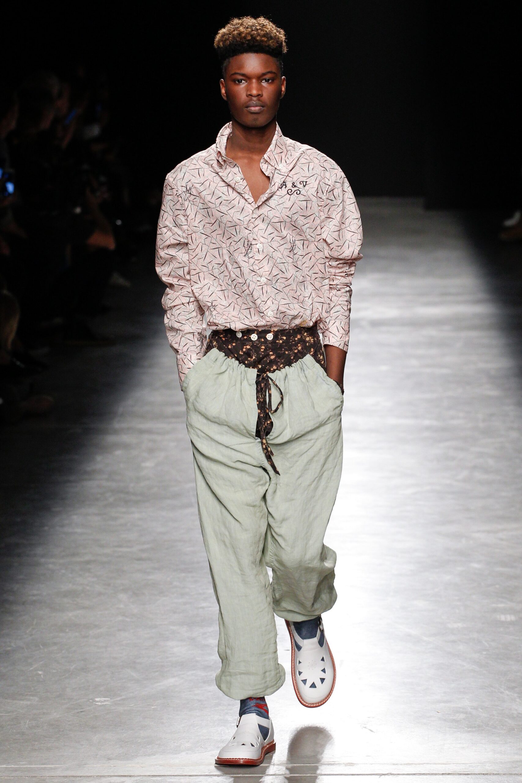 pink printed shirt with green pants