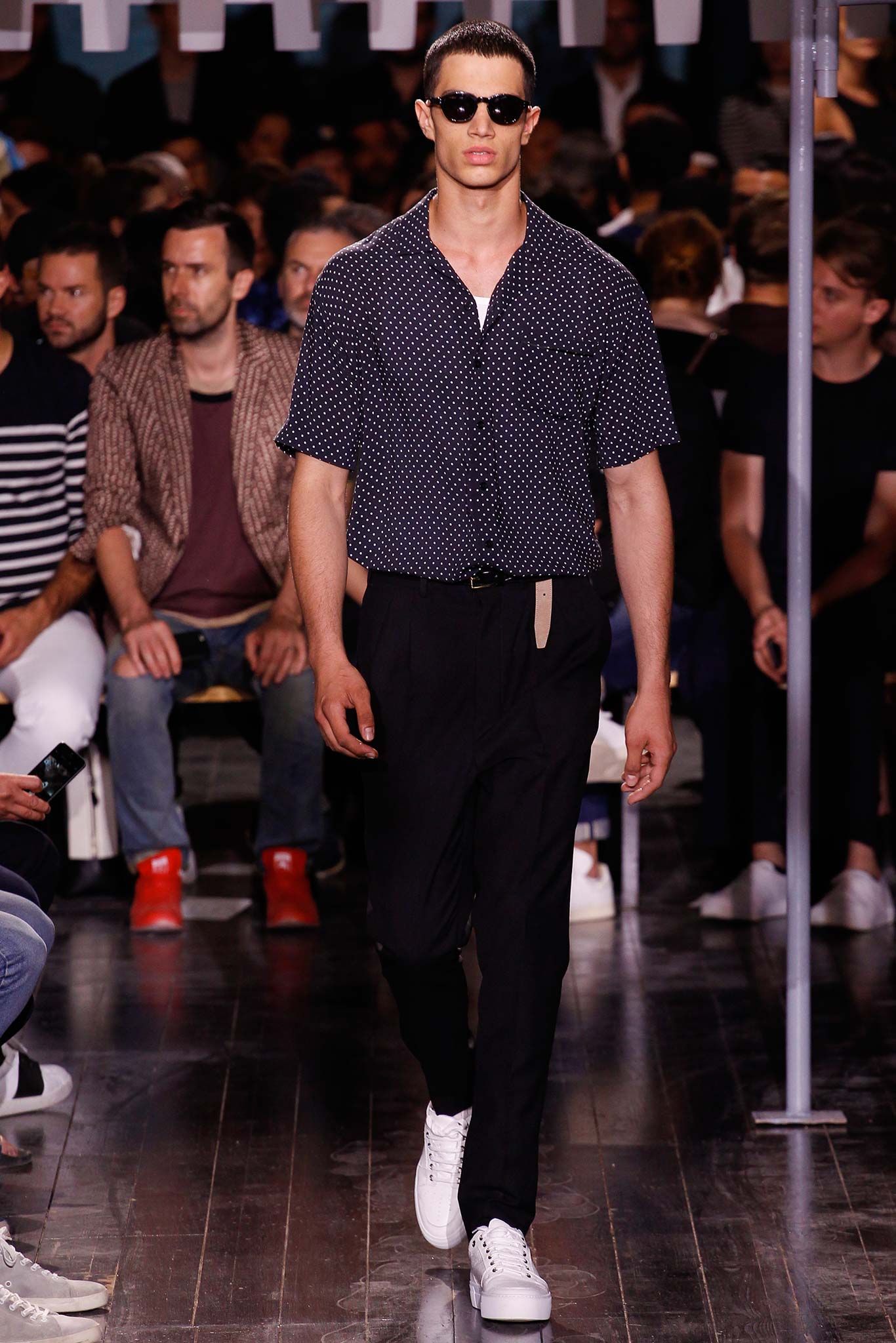 black and white polka-dot shirt with tailored pants