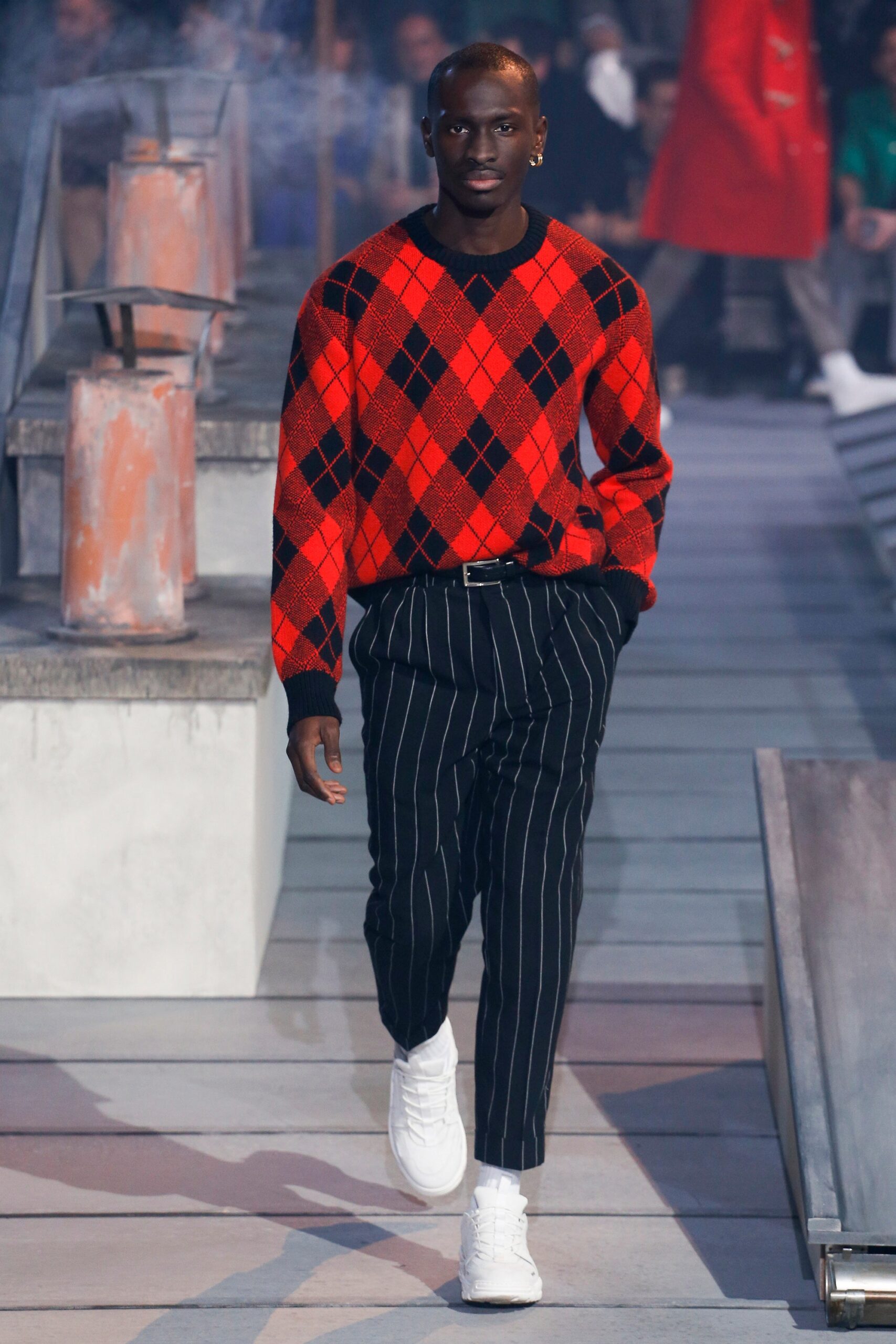 red argyle sweater with striped pants