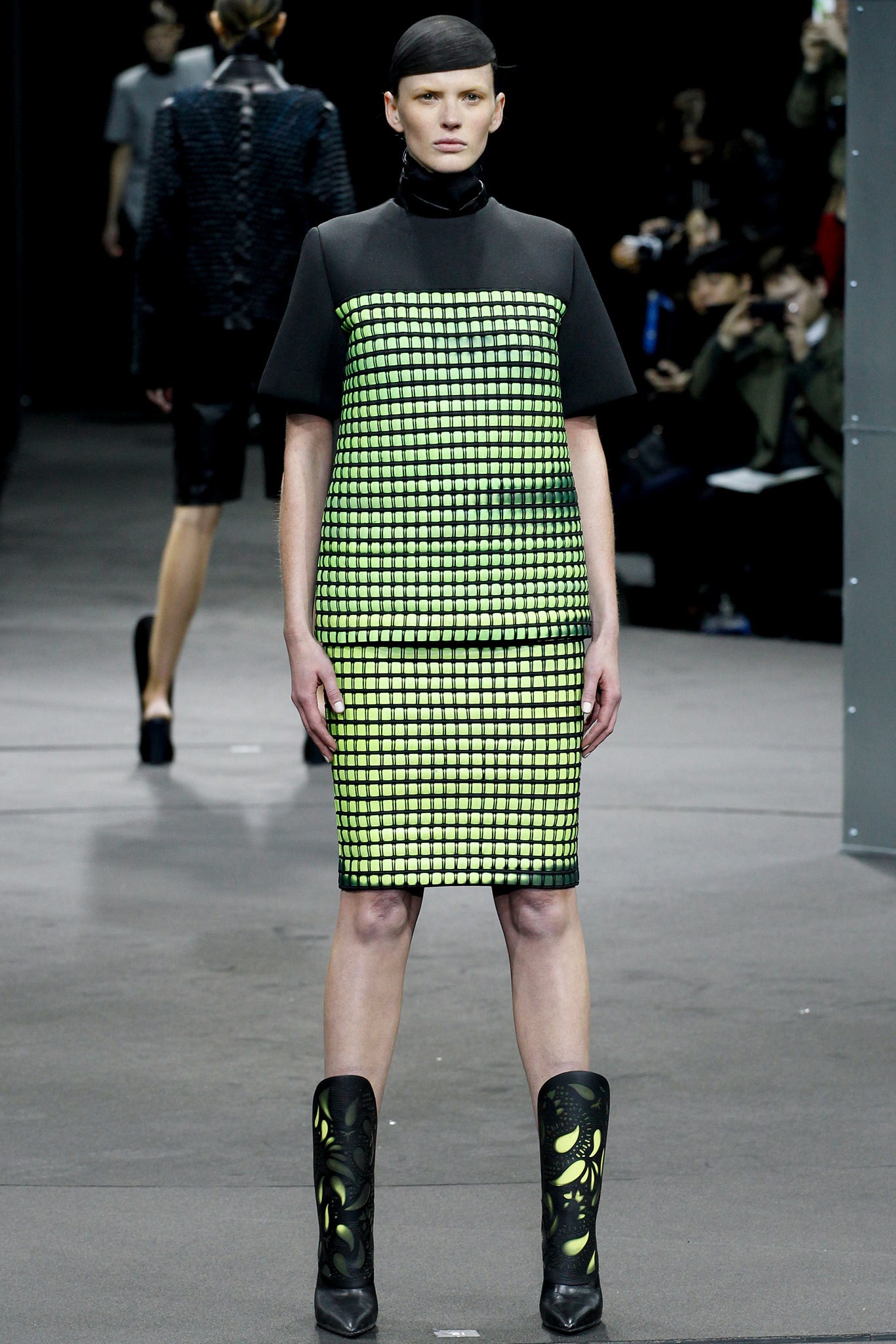 black and green fitted dress with boots