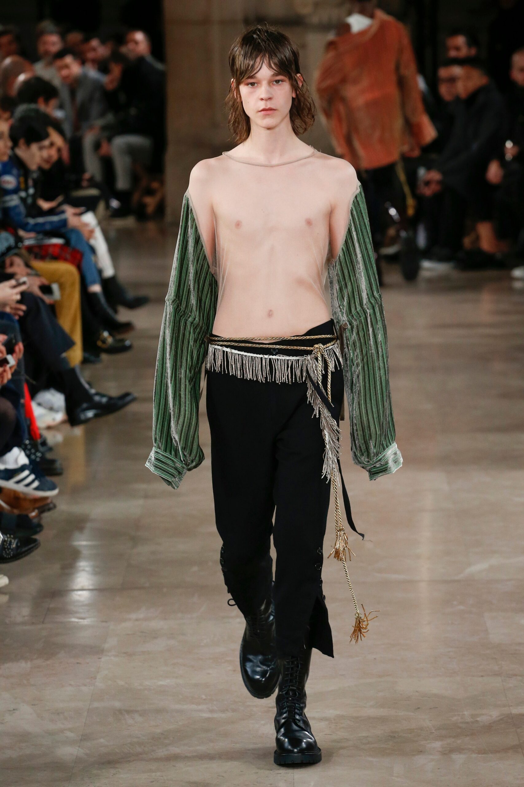 green relaxed top with fringes and black fitted pants