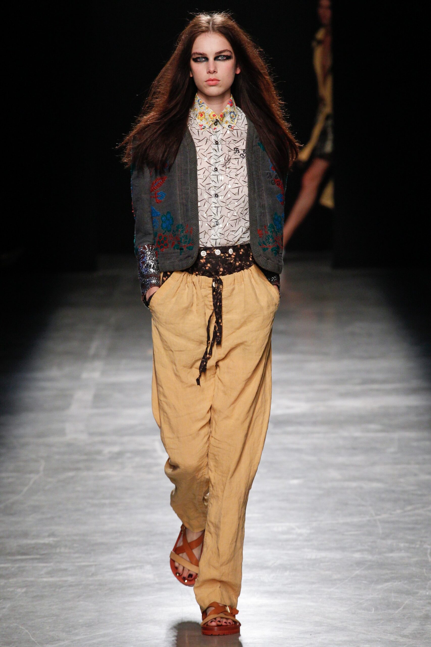 gray embroidered jacket with beige pants