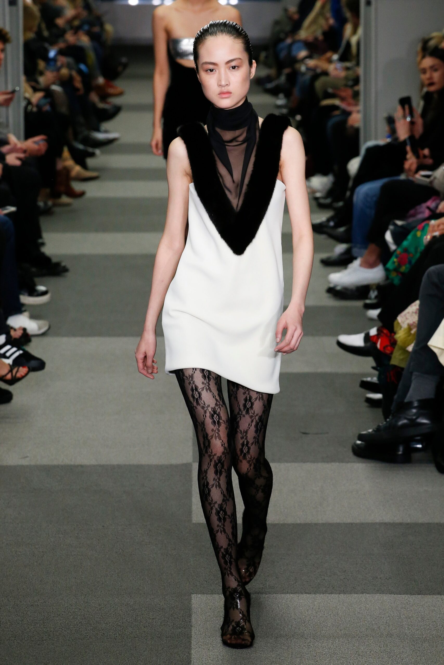 white mini dress with black lace tights