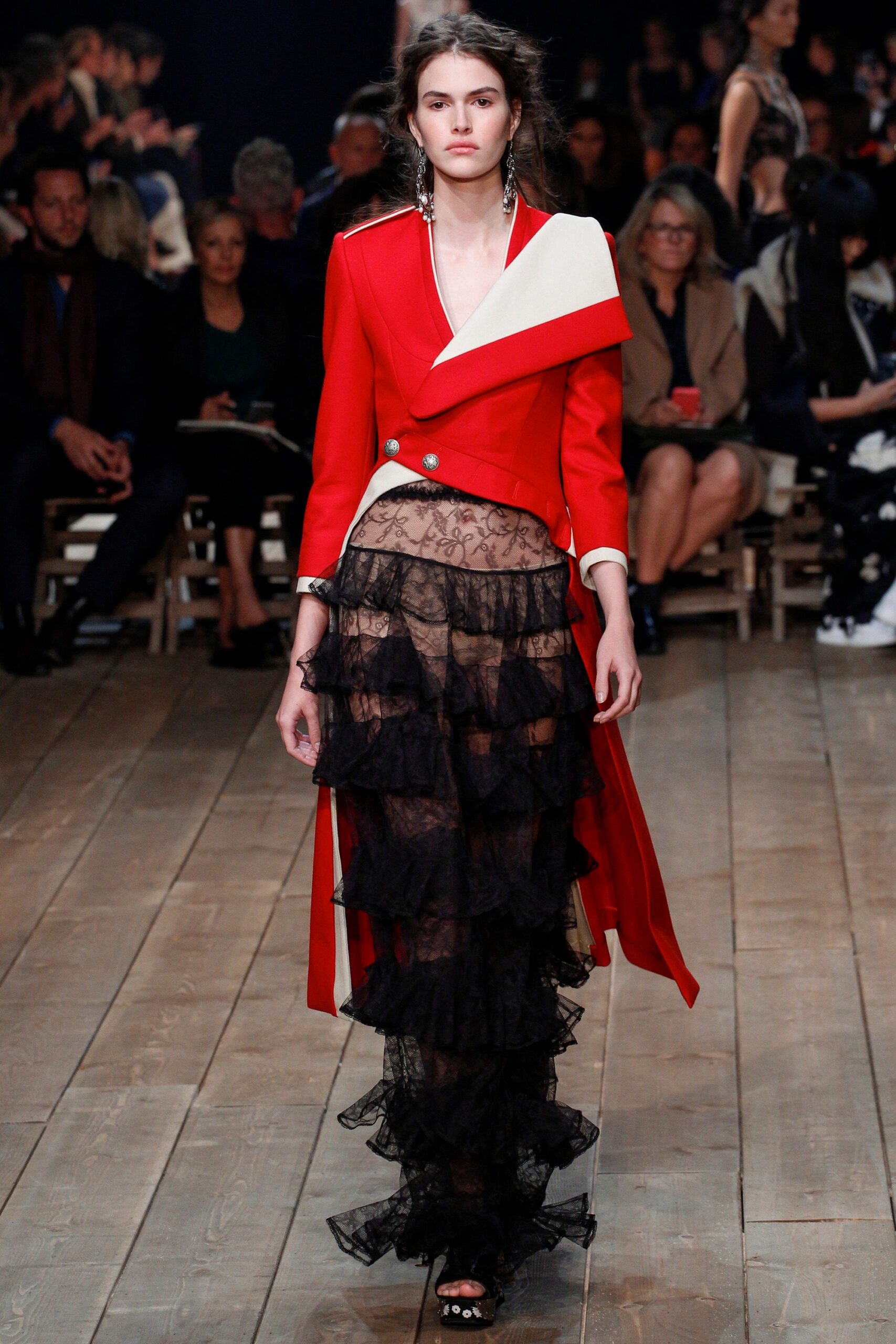 red structured jacket with layered dress