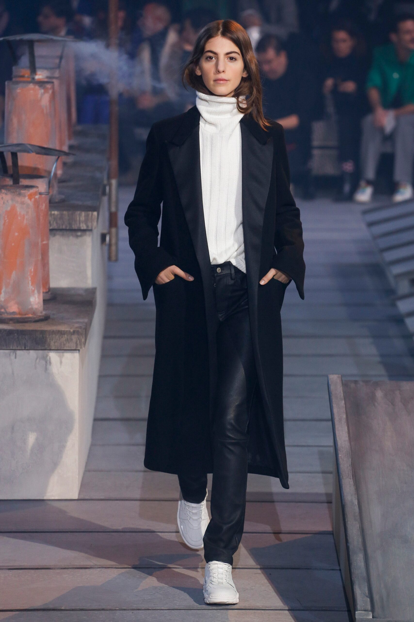 black coat white sweater leather pants