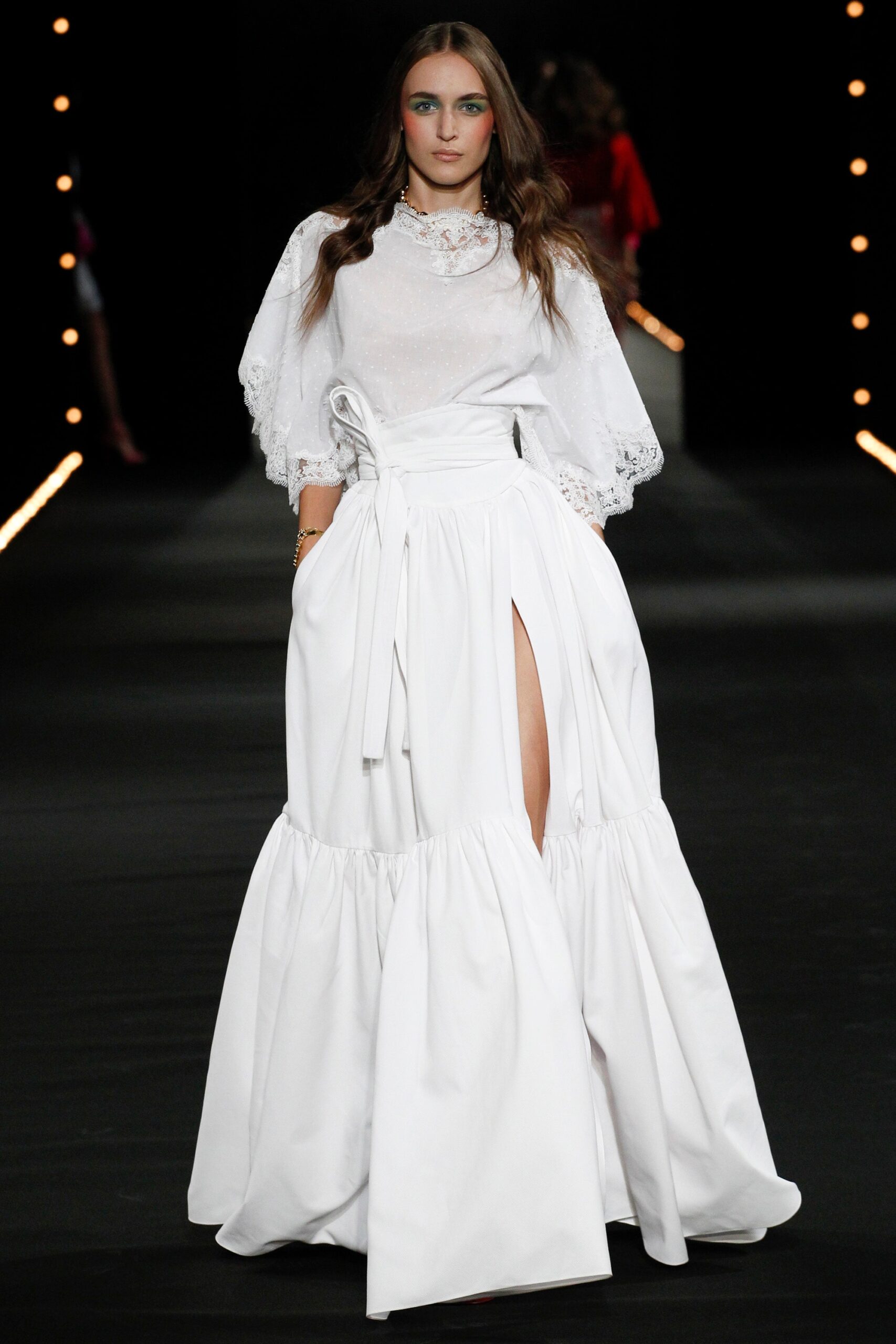 white ruffled blouse and tiered skirt