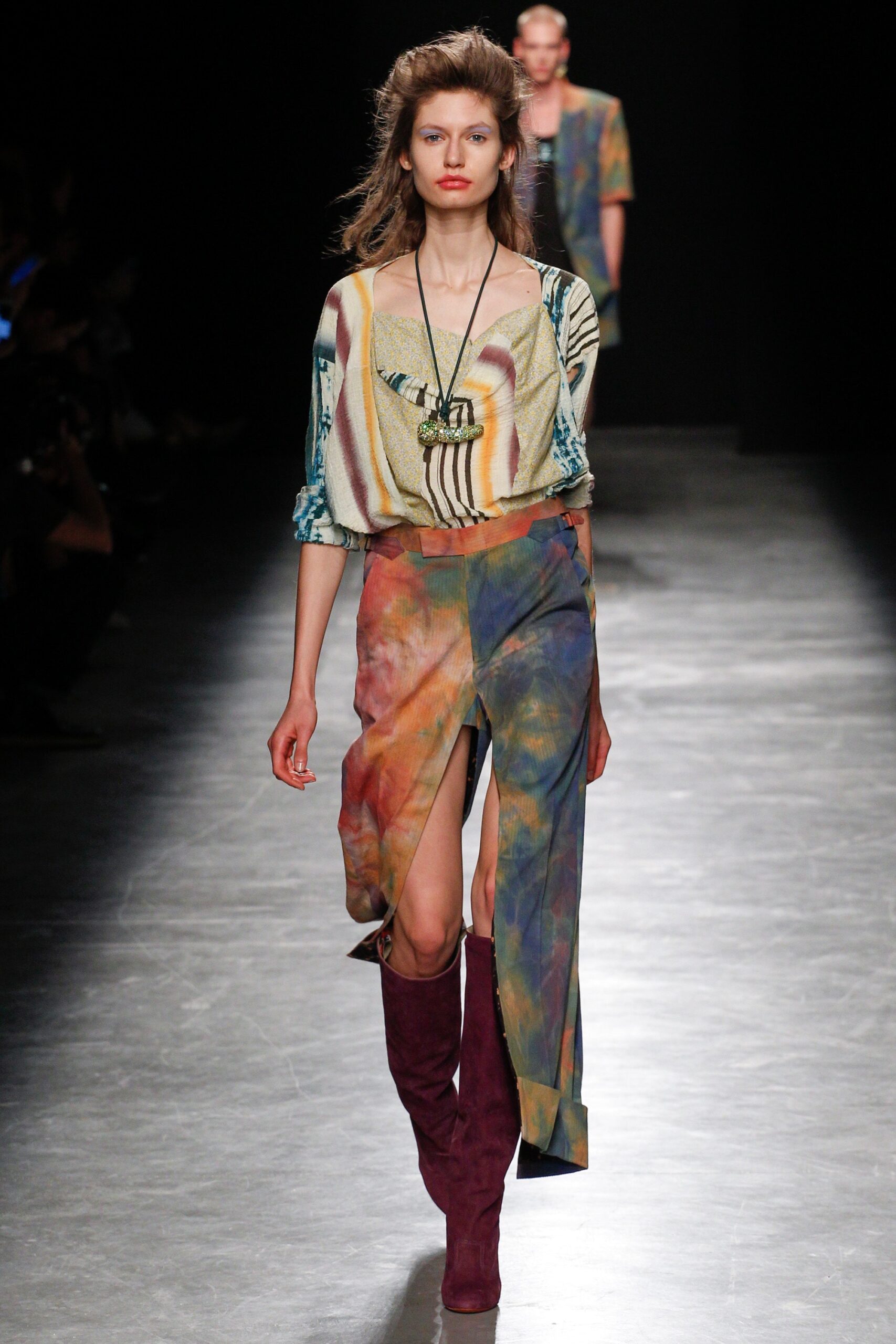 multi-colored top and skirt with red boots