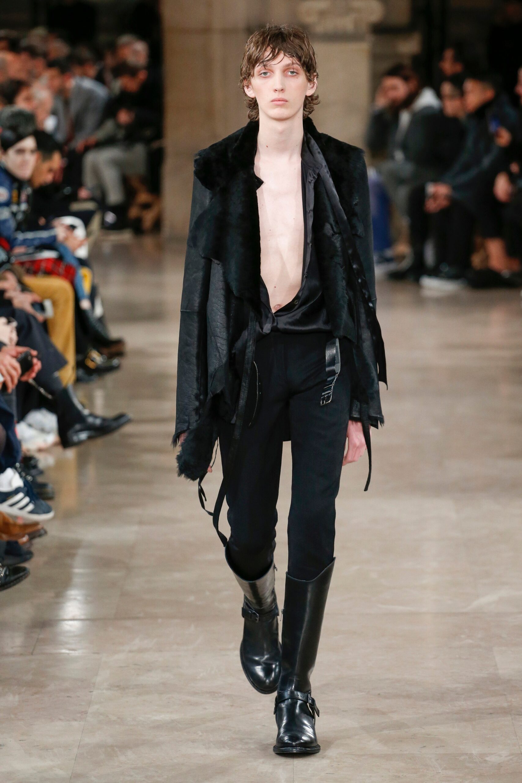 black leather sleeveless jacket and slim pants