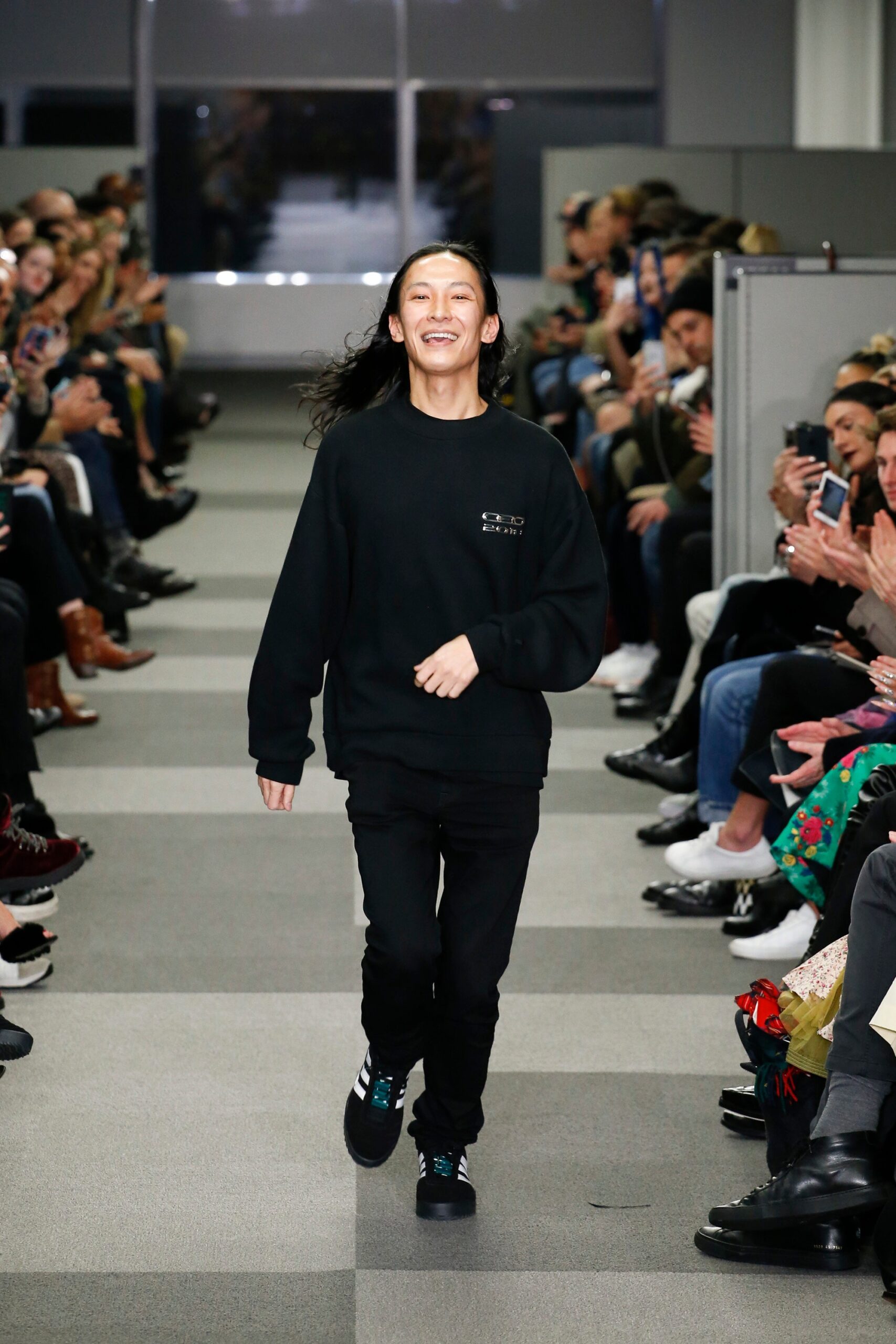 black relaxed sweater and fitted pants