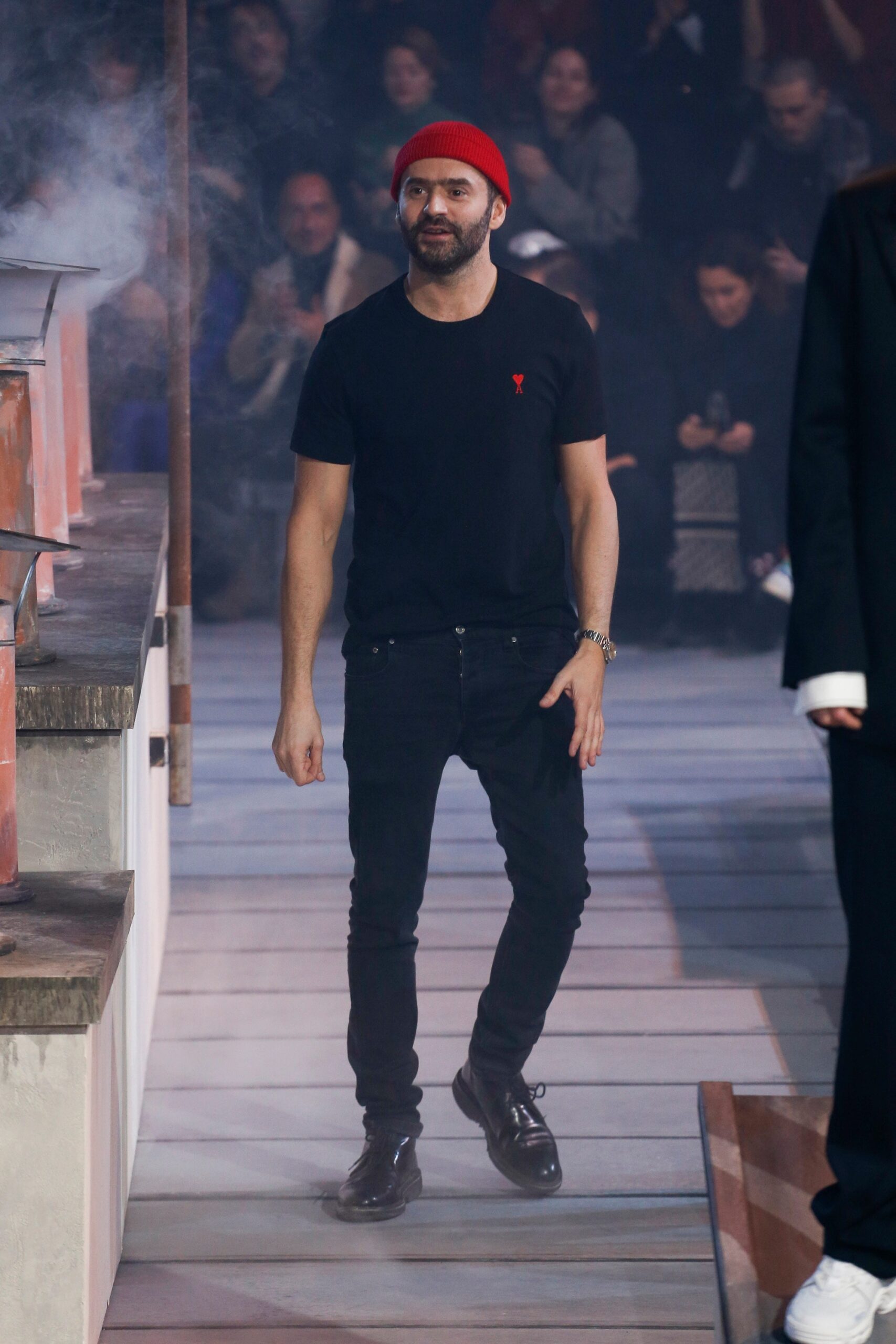 black t-shirt and pants with red hat