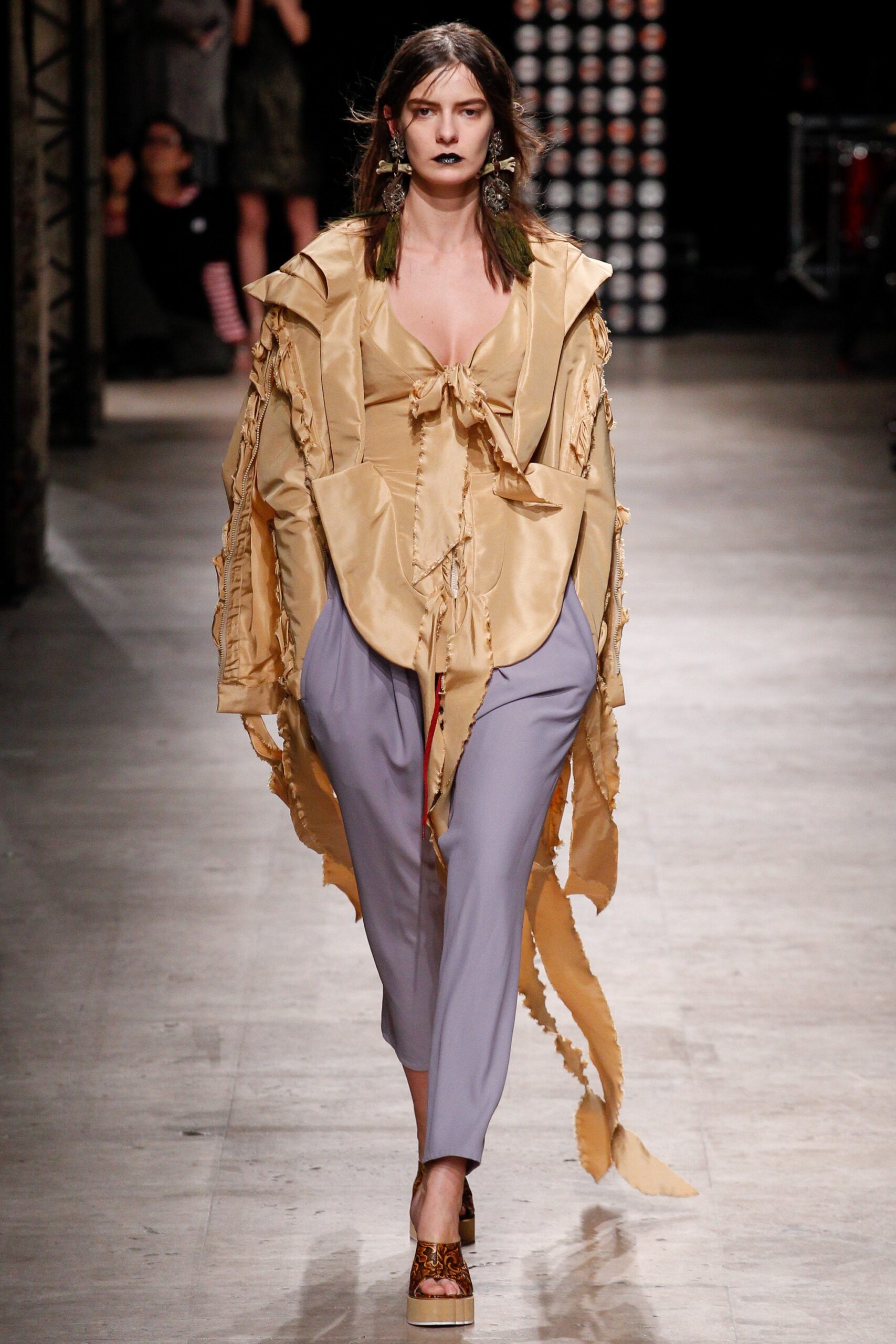 yellow ruffled top gray tailored pants