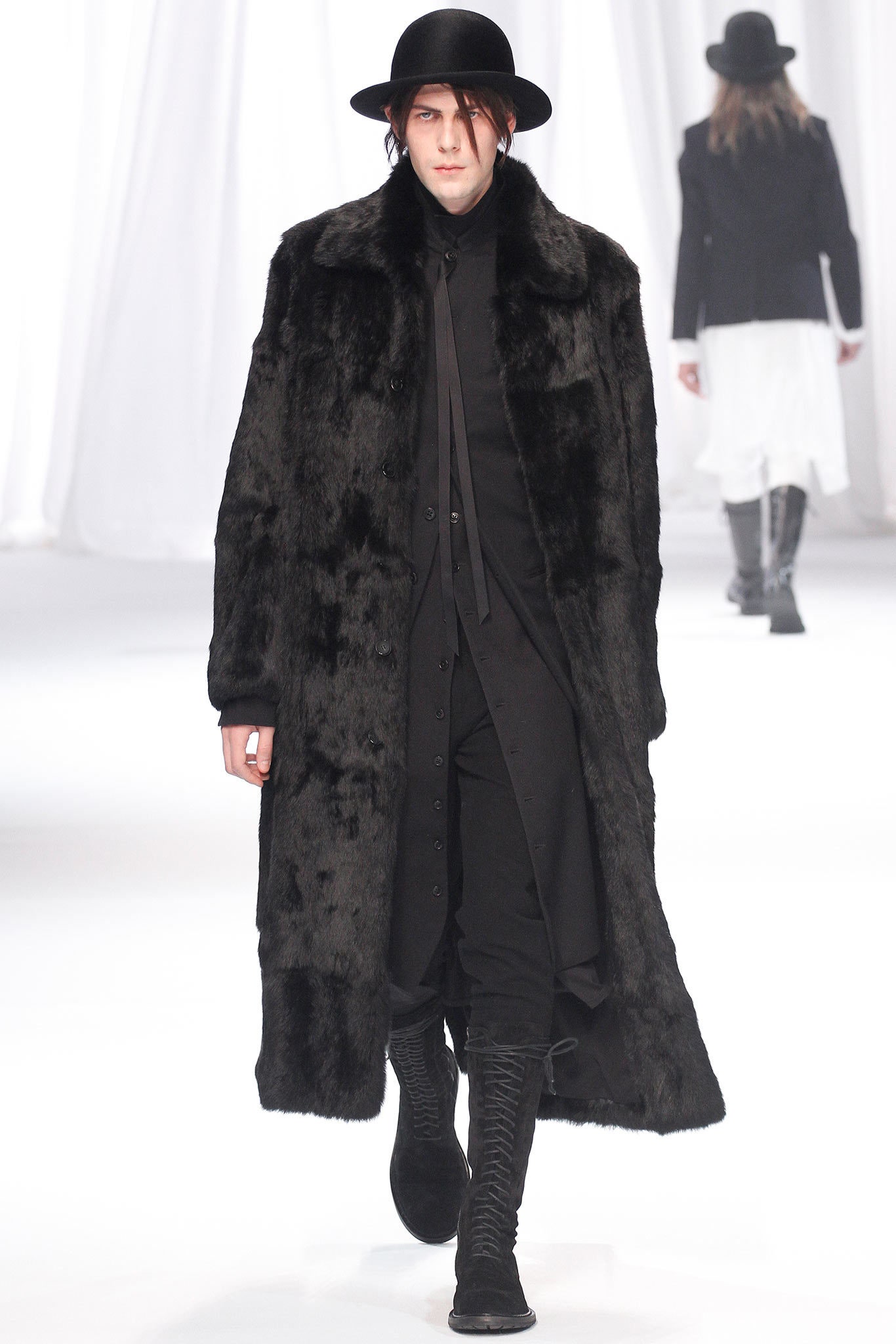 black faux-fur coat with black shirt