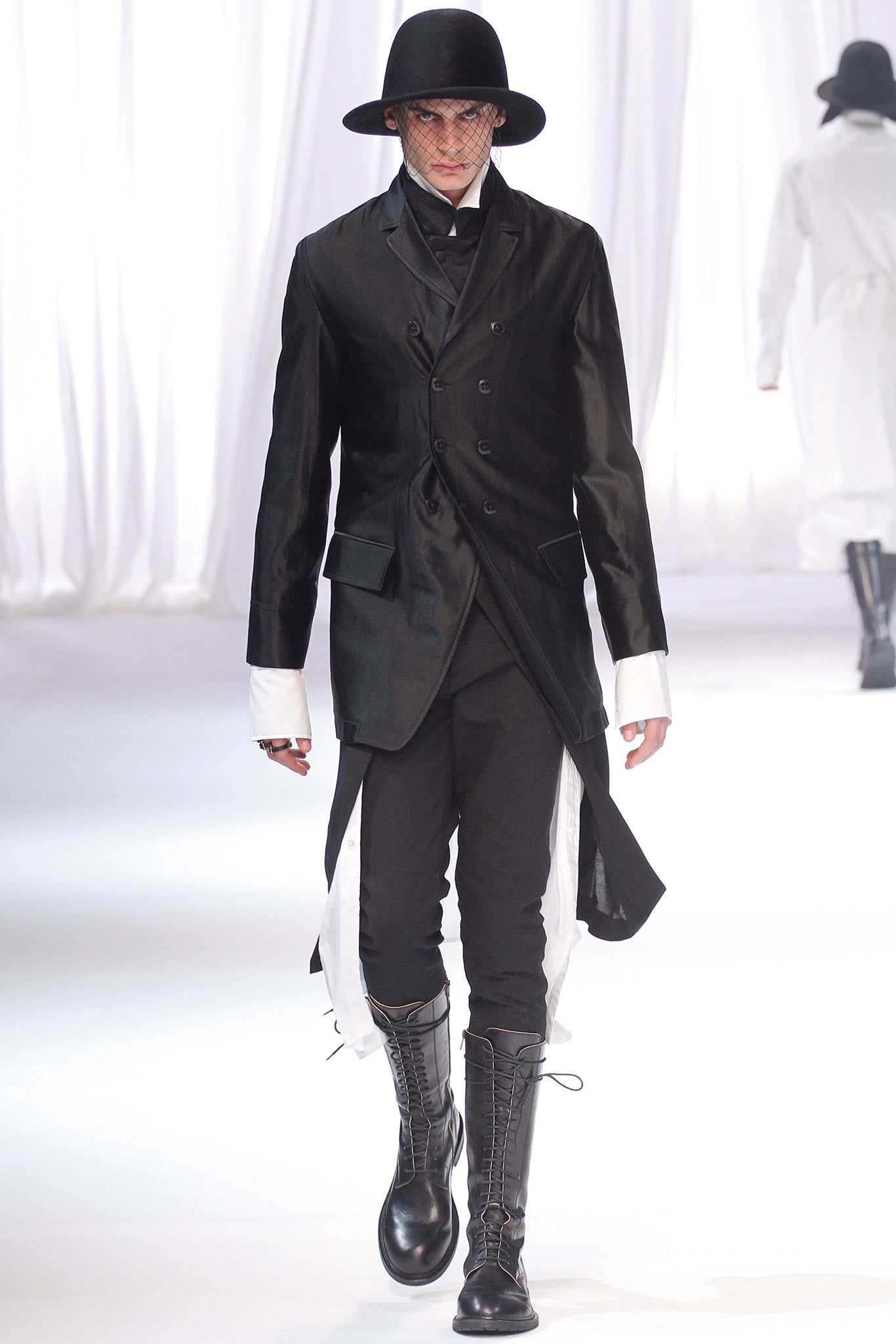 black tailored coat with slim pants