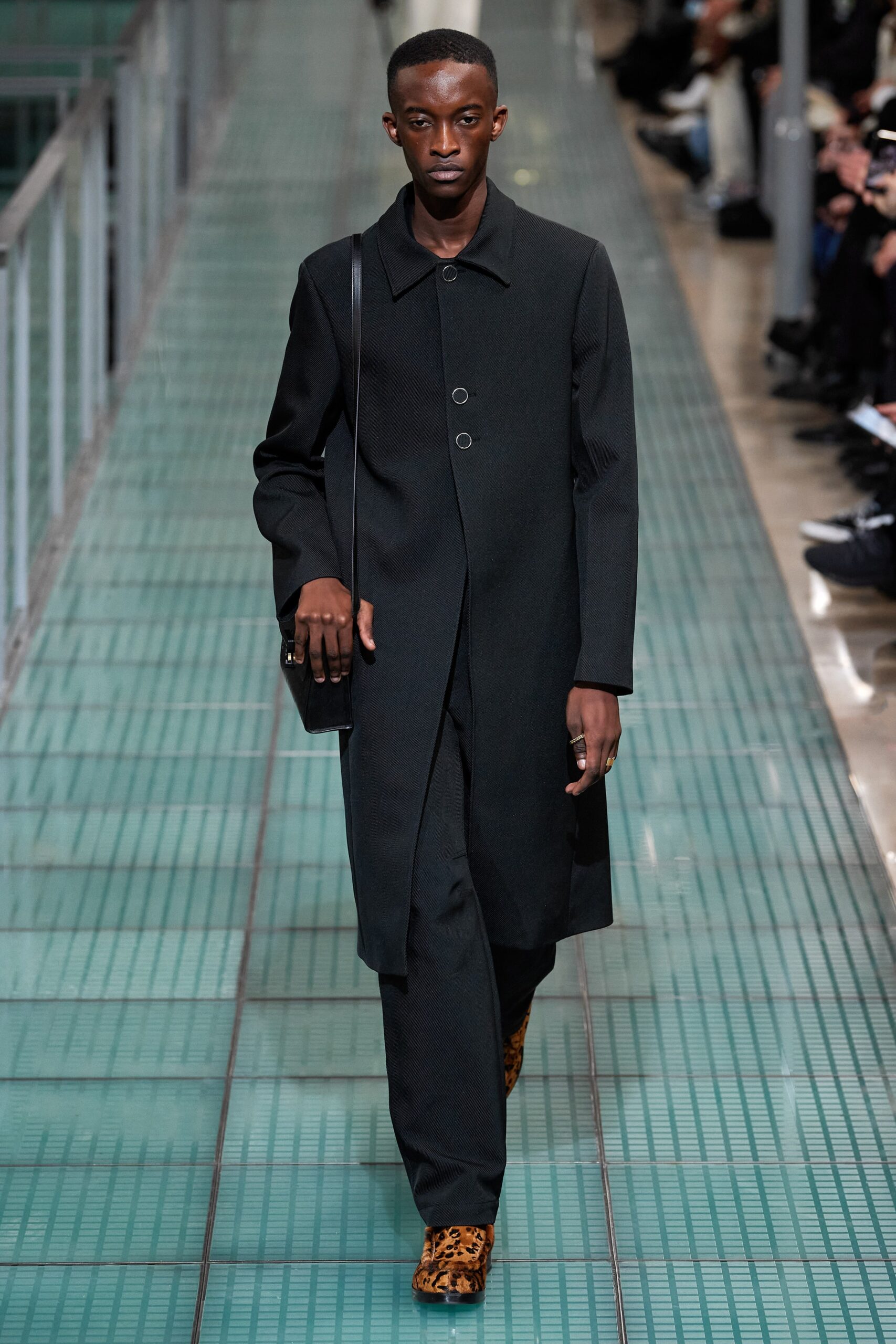 black wool coat and tailored pants