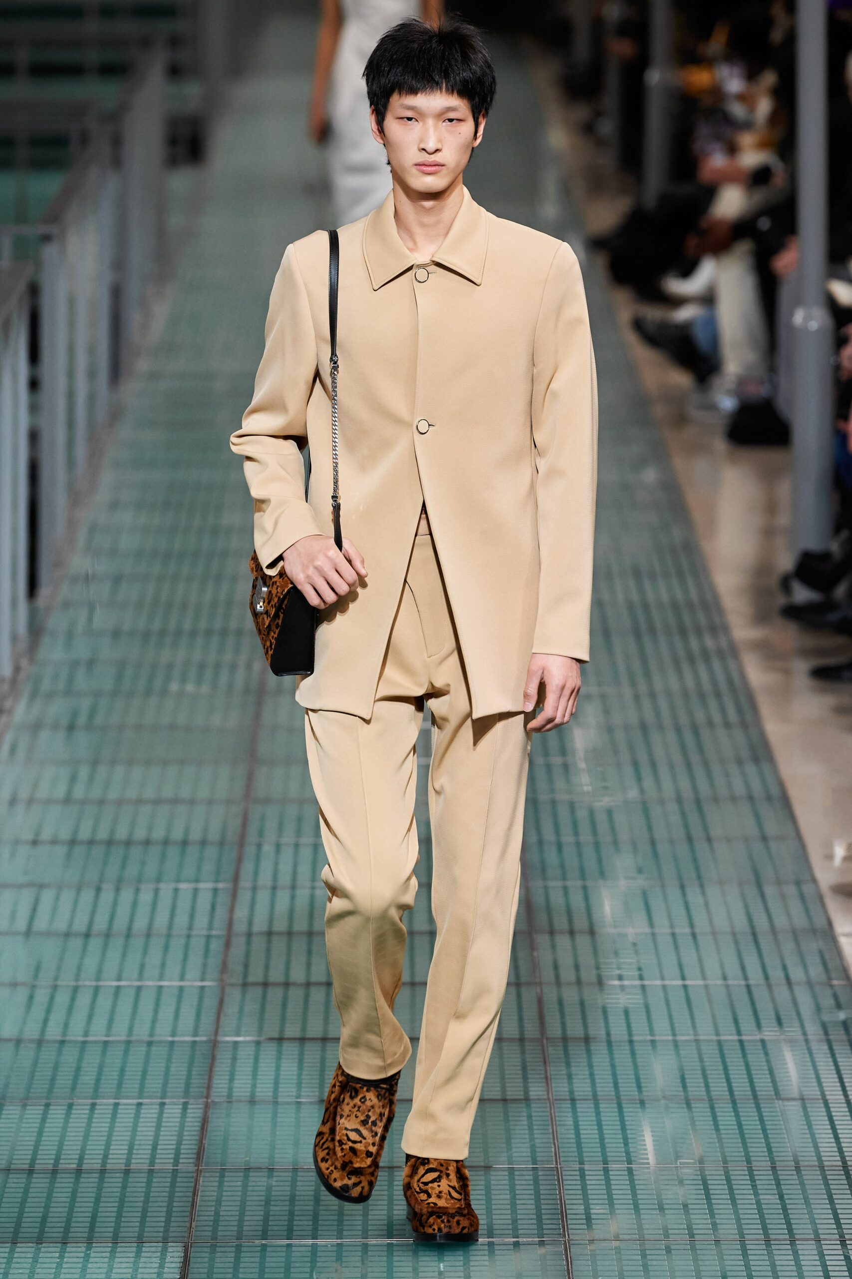 beige tailored suit with animal-print shoes