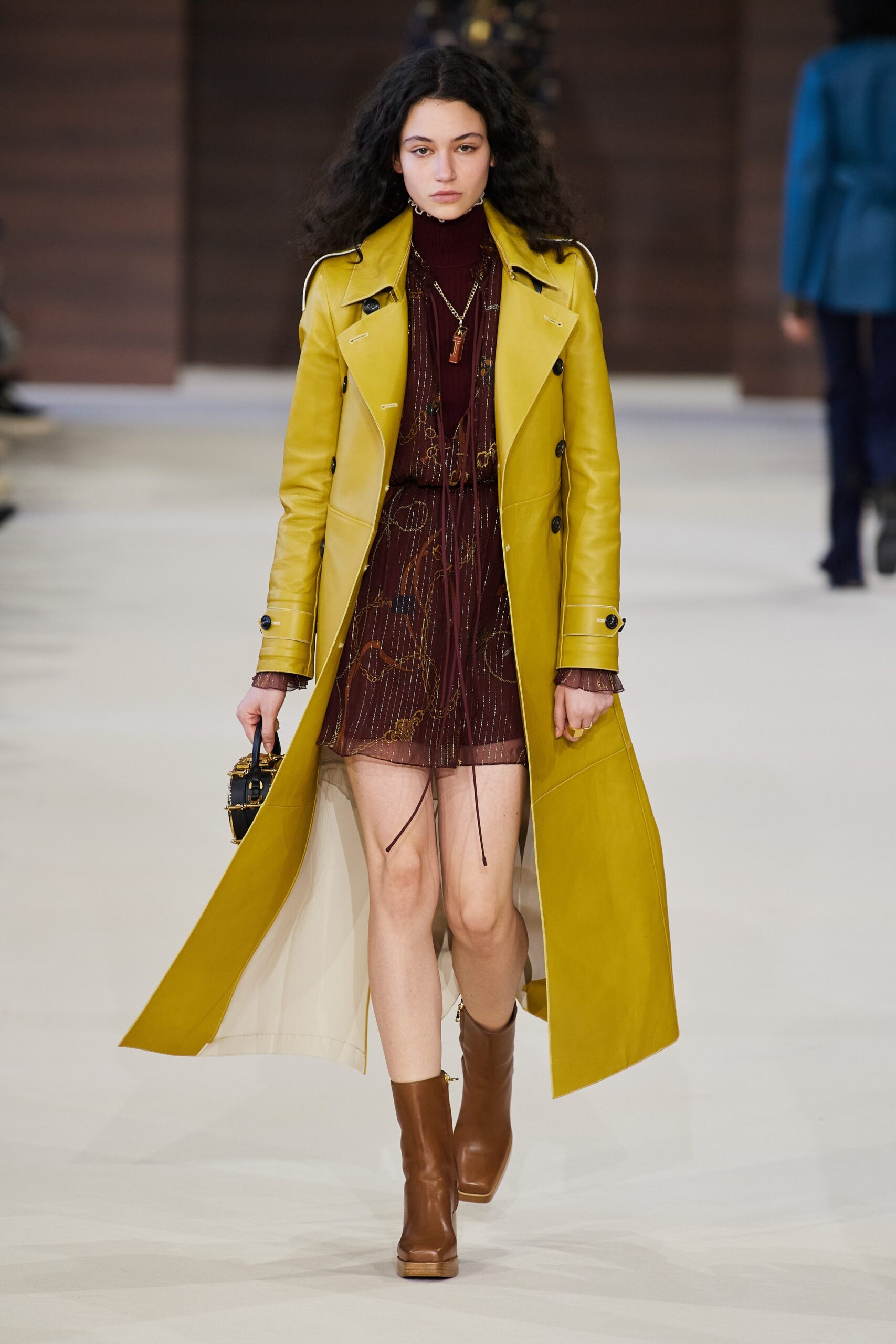yellow leather coat with red dress