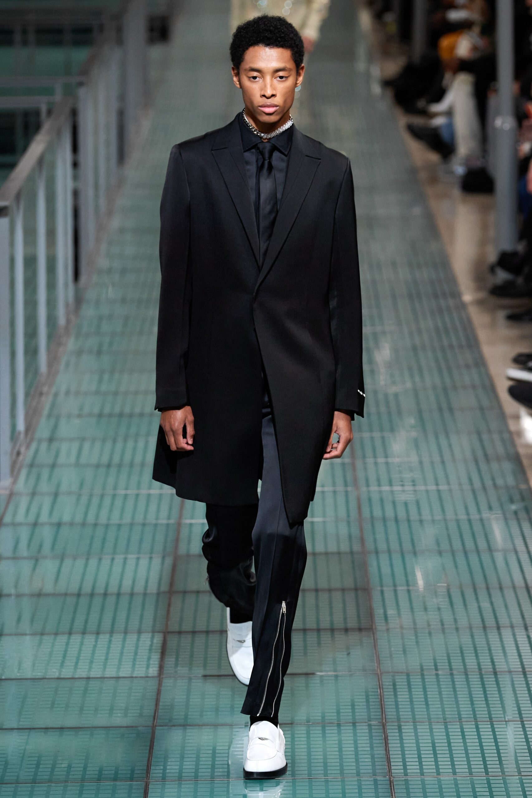 black tailored coat with slim pants