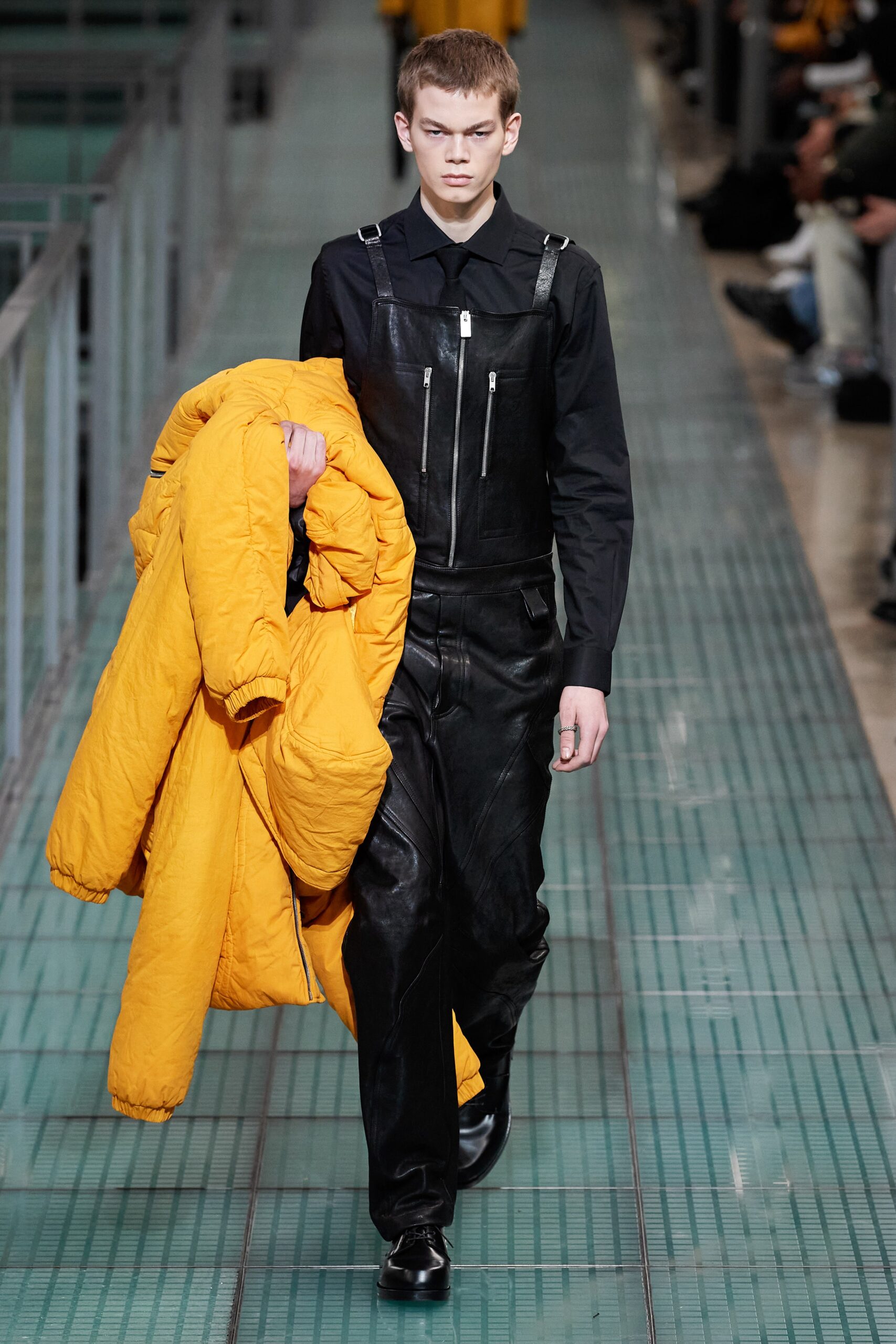 yellow nylon jacket and black leather jumpsuit
