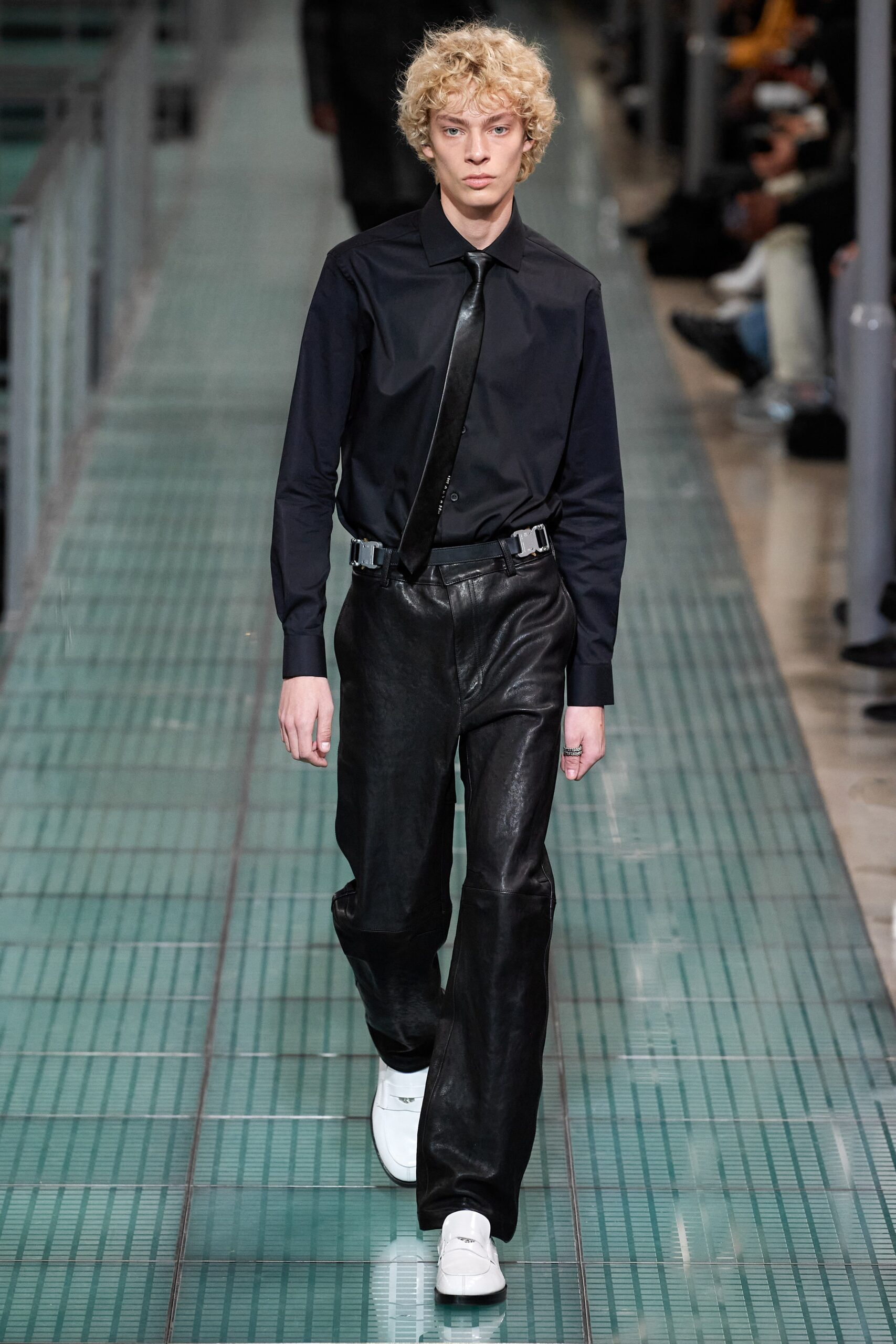 black fitted shirt and relaxed leather pants