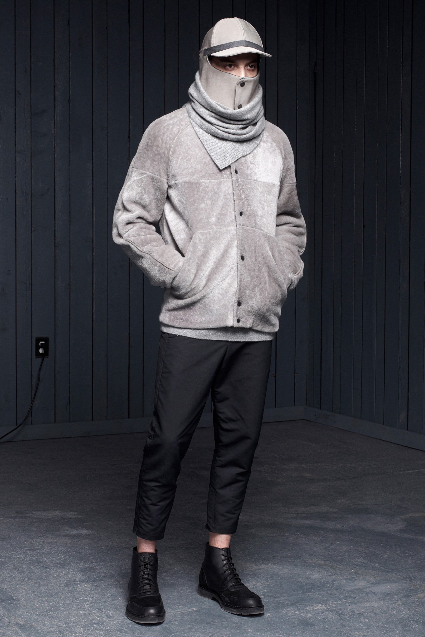 gray faux-fur jacket with black pants