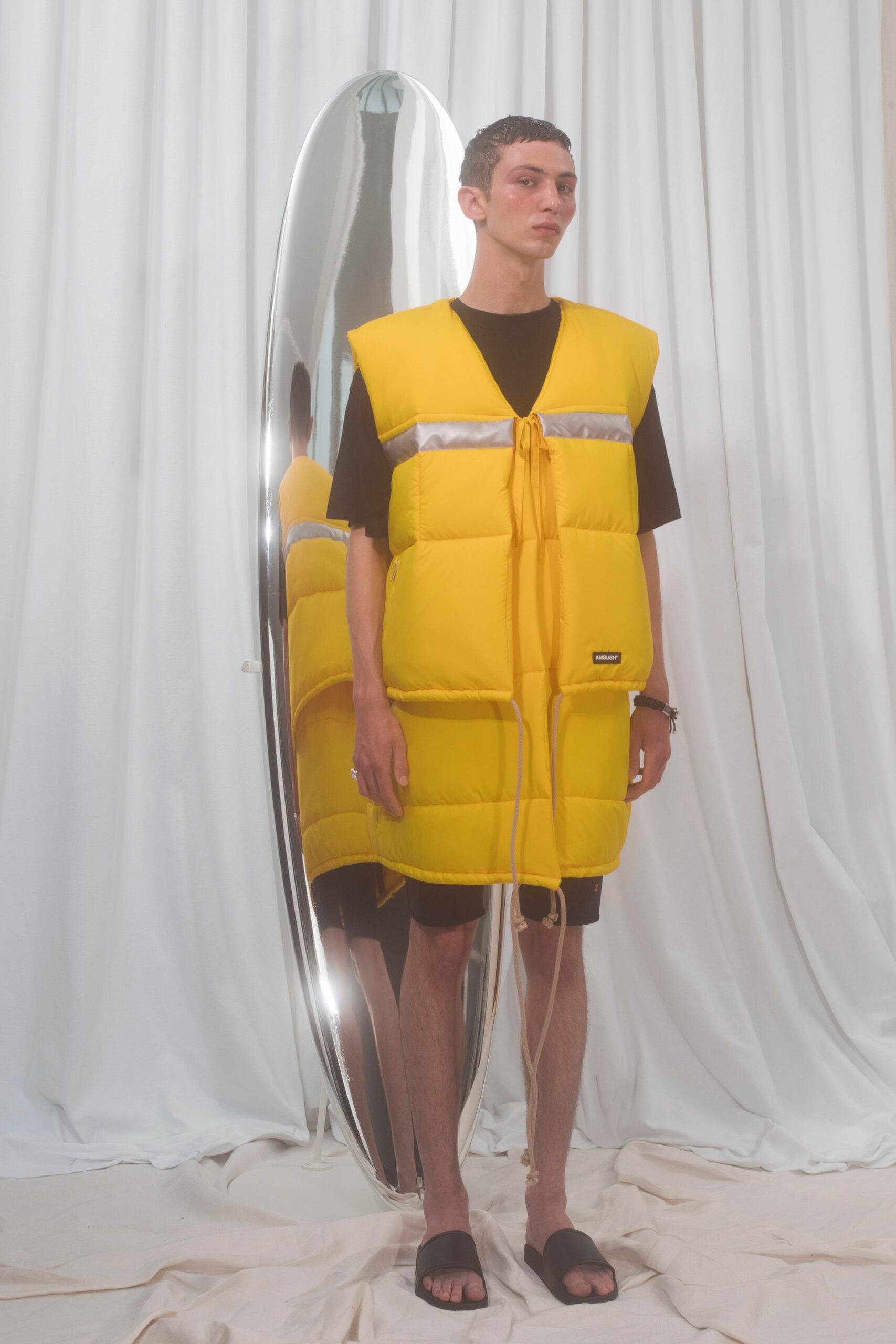 yellow padded vest with black t-shirt