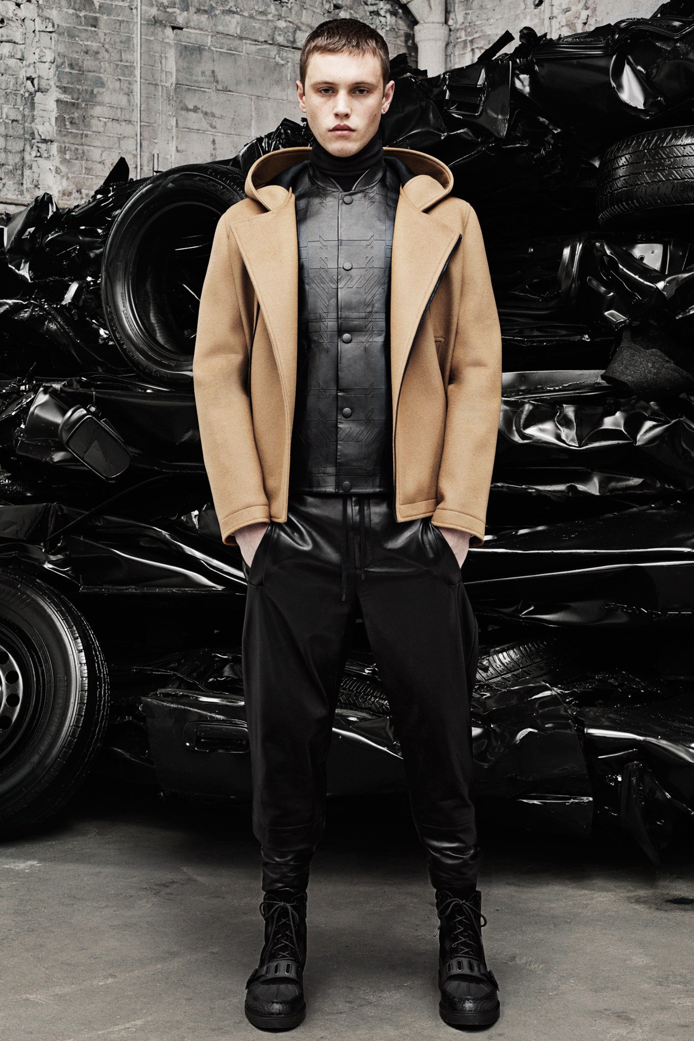 beige wool coat with black leather outfit