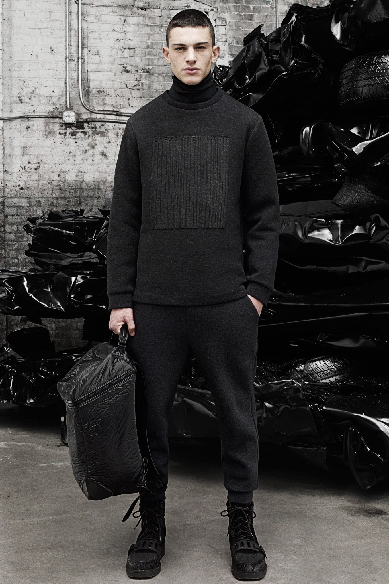 black wool fitted sweater and relaxed pants