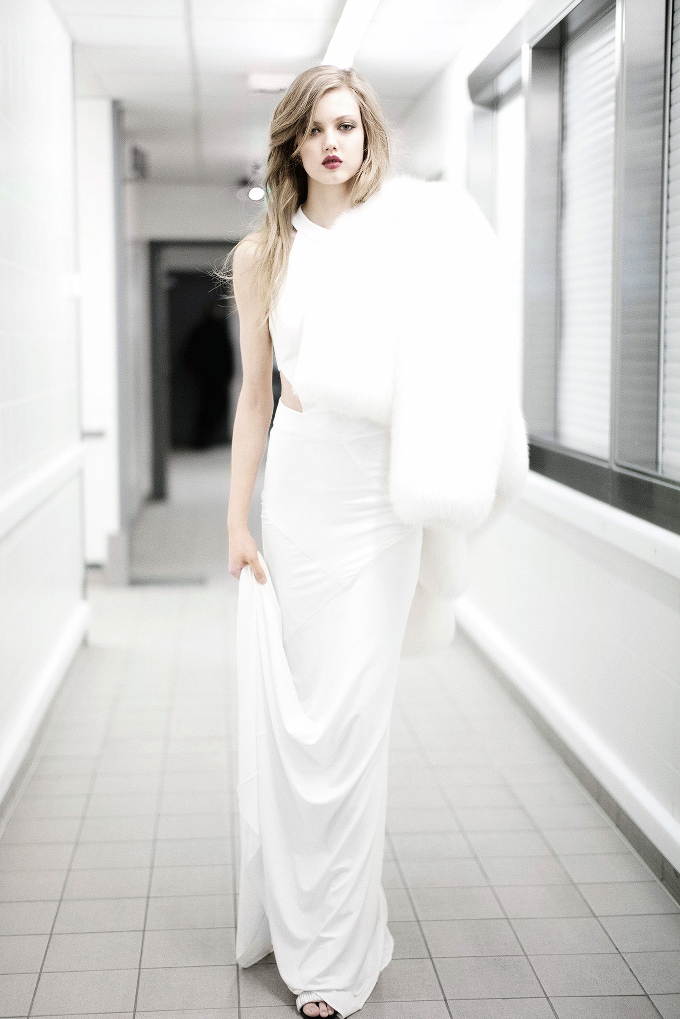 white silk gown with faux-fur cape