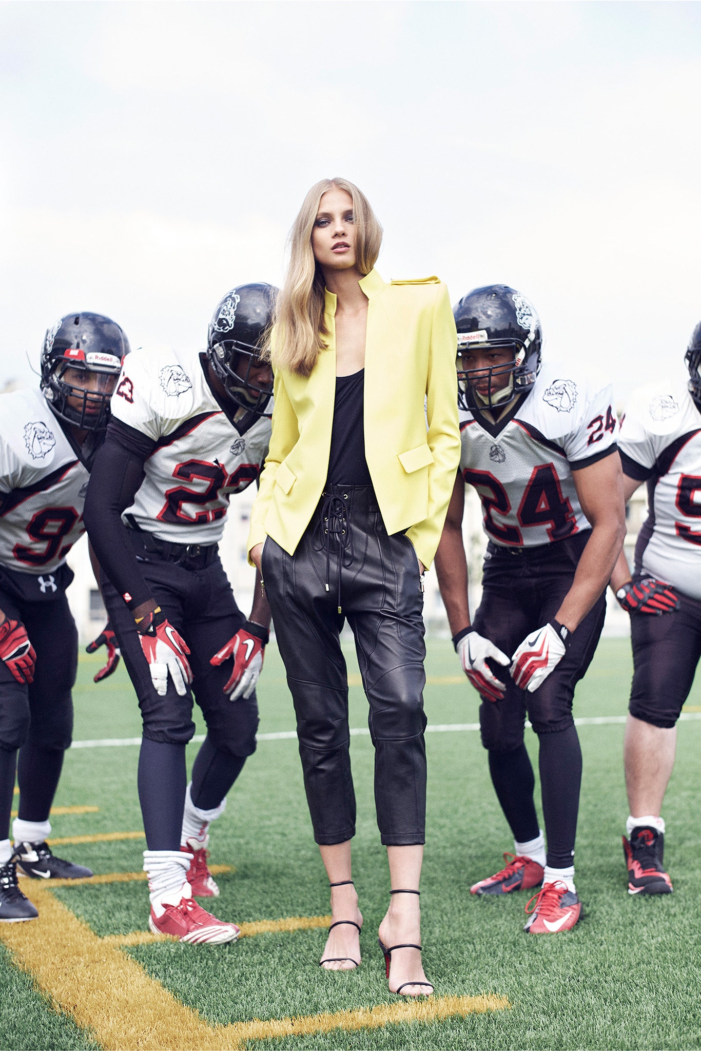 yellow tailored blazer with black leather pants