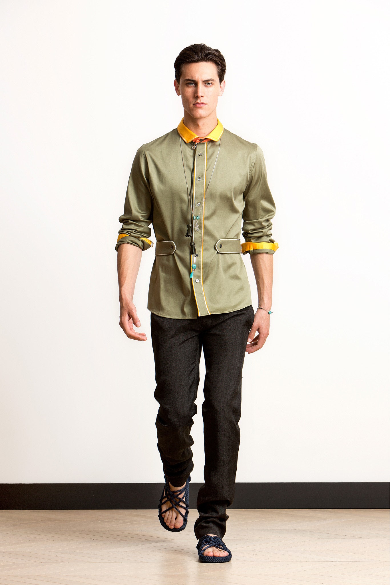 fitted green shirt and black pants