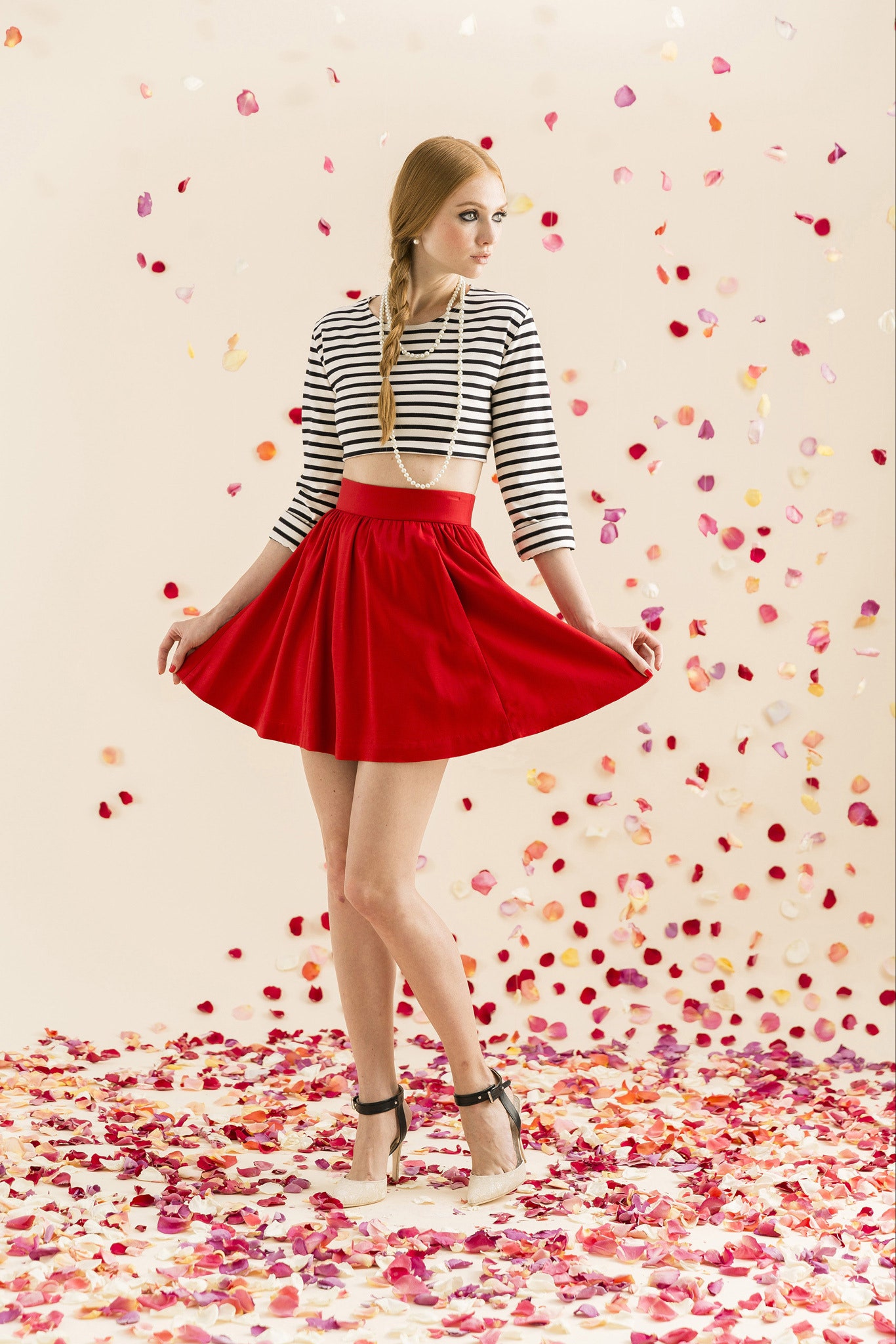 striped crop-top and red pleated skirt