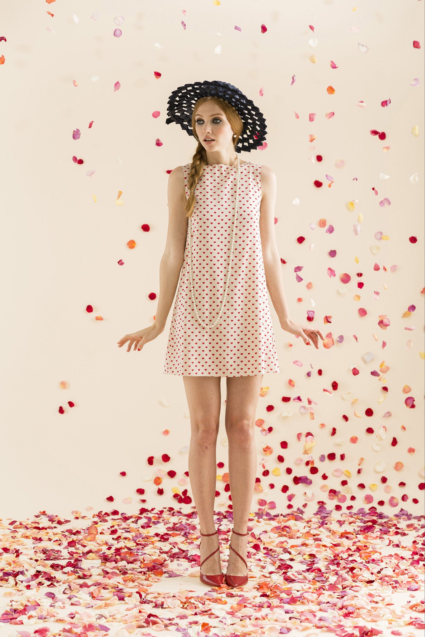 pink polka-dot mini dress with black hat