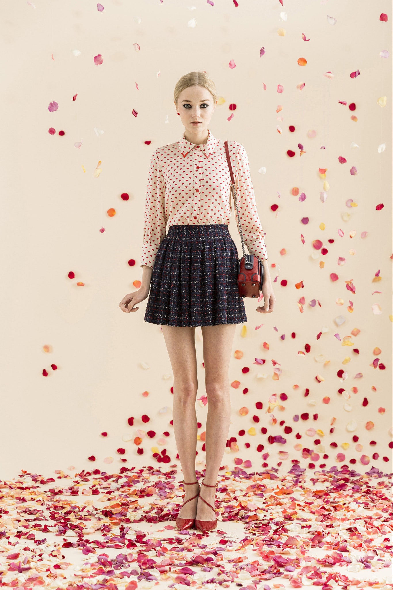 pink polka-dot blouse with black skirt