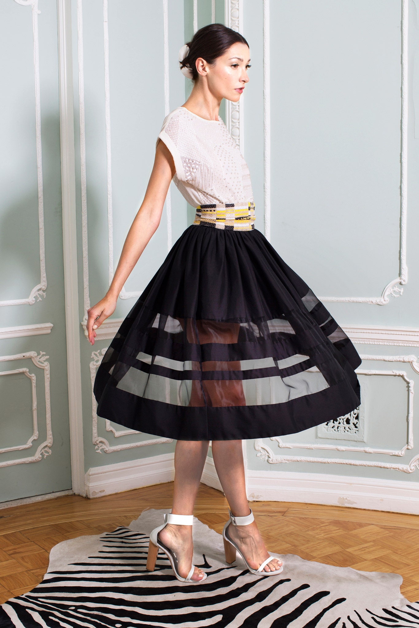 white fitted top with black midi skirt