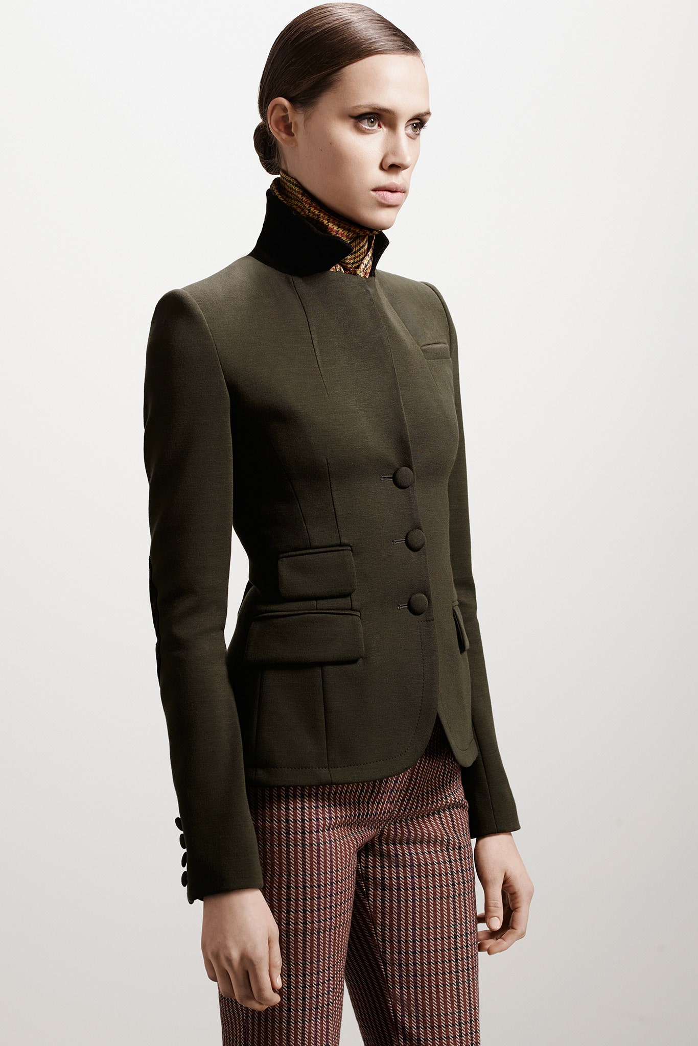 green tailored blazer with checked pants