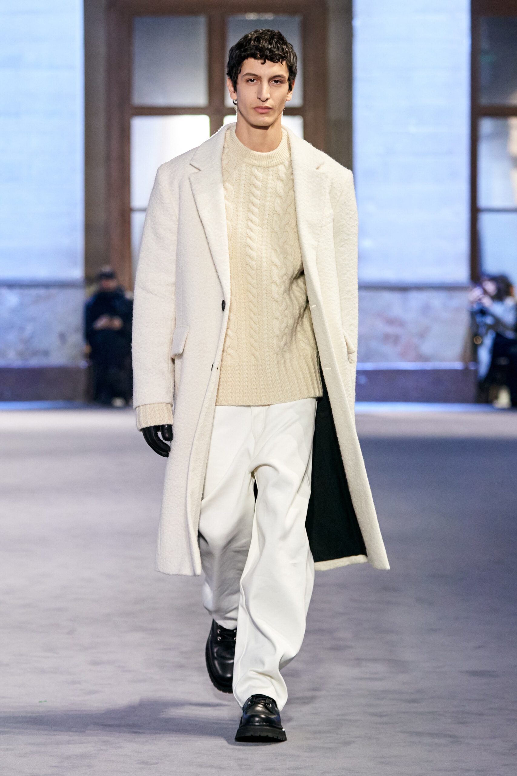 white wool coat beige sweater white pants